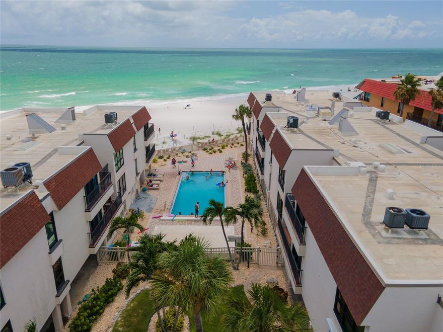 GULF FRONT COMPLEX with great views of the BEACH right from your living room and private patio!  This rarely available, premier complex, "Water's Edge Condo", offers 2 bedrooms, 2 full baths, PRIVATE beach access, a large beachside heated pool, covered shady parking, an elevator, pickleball/tennis and individual unit storage... This well maintained complex offers beautifully landscaped grounds, a newer roof and respectable condo reserve. The unit offers serene views of the water,  turnkey furnishings, Murphy Beds in the guest room to provide flexible use as an office/den when guests not present, easy access to the elevator and more. Make this unit your own spectacular beach retreat with minor updates. Swim your troubles away in either the fantastic private pool OR the GULF. Watch the sunsets nightly for a spectacular show. This great Anna Maria Island property is ready to be yours!