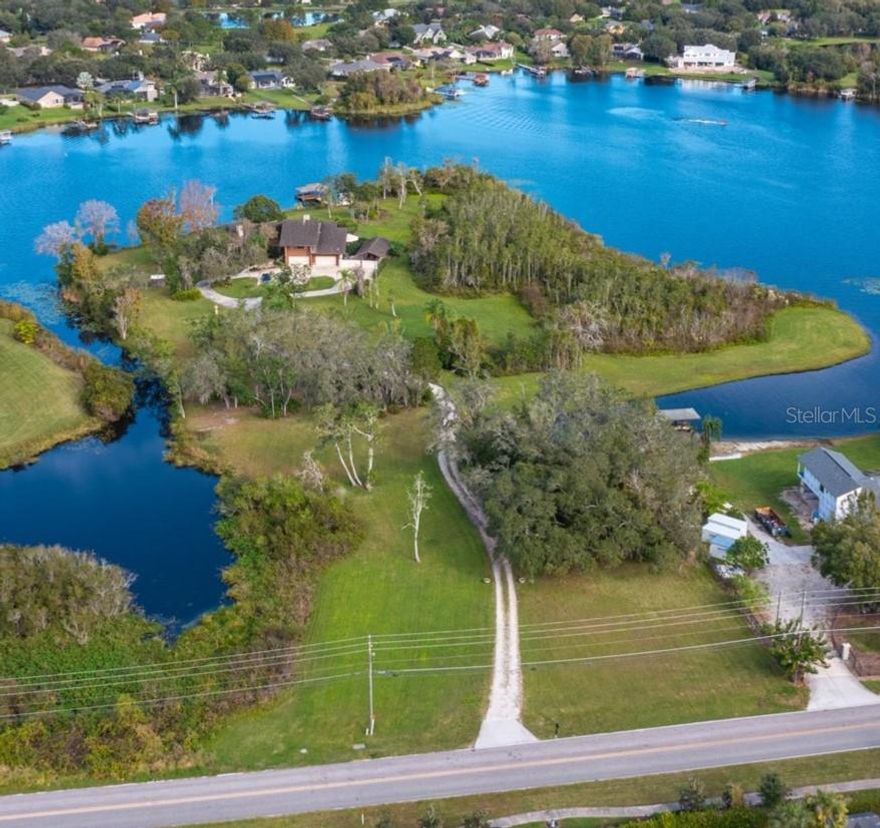 Fantastic opportunity to purchase 12+ acres of private, quiet lake front property in Winter Garden/Windermere area on West Lake Butler Blvd. with 4+ acres high and dry and no HOA. Property currently boasts dock with electricity and boat lift on a skiable lake. There is an existing house that could be remodeled or torn down and start fresh. Home is 4961 square feet and built in 1990 with approximately 844 linear feet of lakefront property on Lake Roper. Home could also be rebuilt as a multigen and could be larger if needed with ample room for multiple garage spaces as well (example of possible home and floor plan attached in photos). This is a RARE OPPORTUNITY to acquire this much lakefront property and land but be in close proximity to city center, major thoroughfares, restaurants, theme parks, international airports.  Example photos of possible home and floor plan provided by custom home builder, David Konkol Custom Homes.