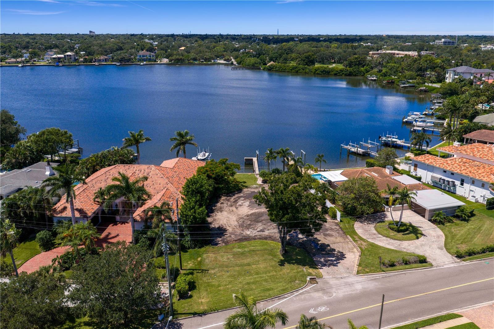 WELCOME TO YOUR SLICE OF PARADISE on one of St. Petersburg's most prestigious addresses. The property has been cleared and ready to build your DREAM HOME. Seawall, Dock and Lift. Enjoy the serene experience of watching dolphins and manatees play off your dock. Imagine waking up each morning to the calming sight of dolphins gliding through Coffee Pot Bayou and winding down your day while taking in the breathtaking sunsets from your outdoor space. This exceptional waterfront property presents an incredible opportunity to create your dream residence in an unparalleled location. You are just minutes from the vibrant Downtown St. Petersburg, easily accessible by boat, golf cart, or bike ride, ensuring you're never far from world-class dining, eclectic shopping, and a dynamic cultural scene. This is the perfect opportunity to build your custom masterpiece from the ground up, the possibilities are endless. Imagine crafting a stunning residence that showcases the beautiful views and embodies the luxurious lifestyle you've always dreamed of. This is more than just a property; it's a chance to create a legacy in the heart of St. Petersburg.