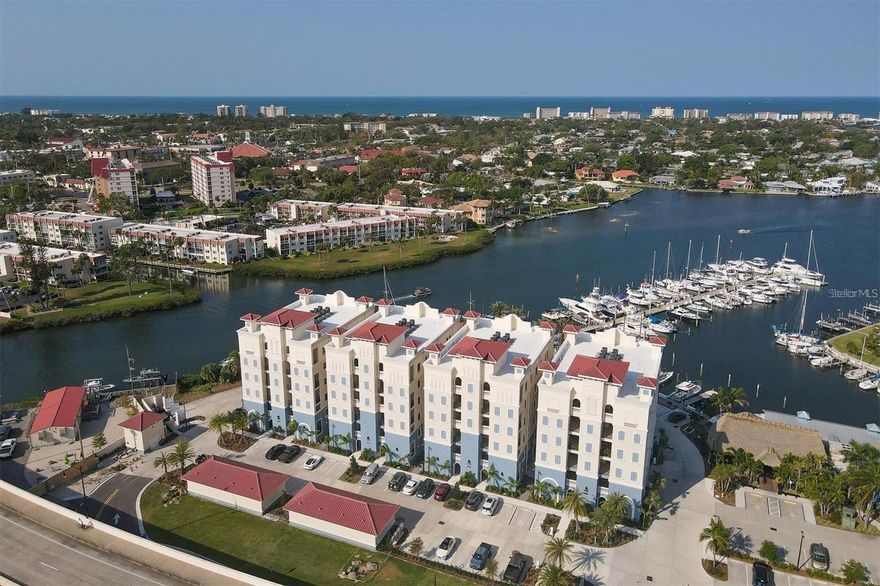 Newly Constructed, NEVER Occupied, Luxury Condominium with panoramic views of the Marina, Intracoastal Waterway, and the Gulf of Mexico. The almost 2,000 sq. ft. residence offers 3 bedrooms, 2 bathrooms, 10’ ceilings, solid wood doors, crown molding, and plantation shutters. The large Kitchen has GE stainless steel appliances, quartz countertops, under cabinet lighting, custom exhaust hood, Timberlake solid wood cabinetry, an 11 ft peninsula, and an antique custom backsplash. Enjoy the amazing West Coast sunsets from your balcony off the great room. The Master Bedroom offers an over-sized walk-in closet and sliders to your private lanai. Inside the Master Bathroom there are two oversized vanities and a custom walk-in Roman shower. This unit comes with a one-car enclosed garage underneath the building for maximum privacy and has an abundance of parking available for all of your guests. A fully secured elevator and stairwell are provided from garage level to your designated living floor. Relax in the heated swimming pool with a cabana and poolside gazebo. Porto Vista is a custom designed, luxury, small, exclusive community with only 40 units and located in the heart of Venice. You are just a short walk away from Historic Downtown Venice, entertainment, shopping, restaurants, beaches, and golfing. This opportunity will not last long, call and schedule your private showing today!