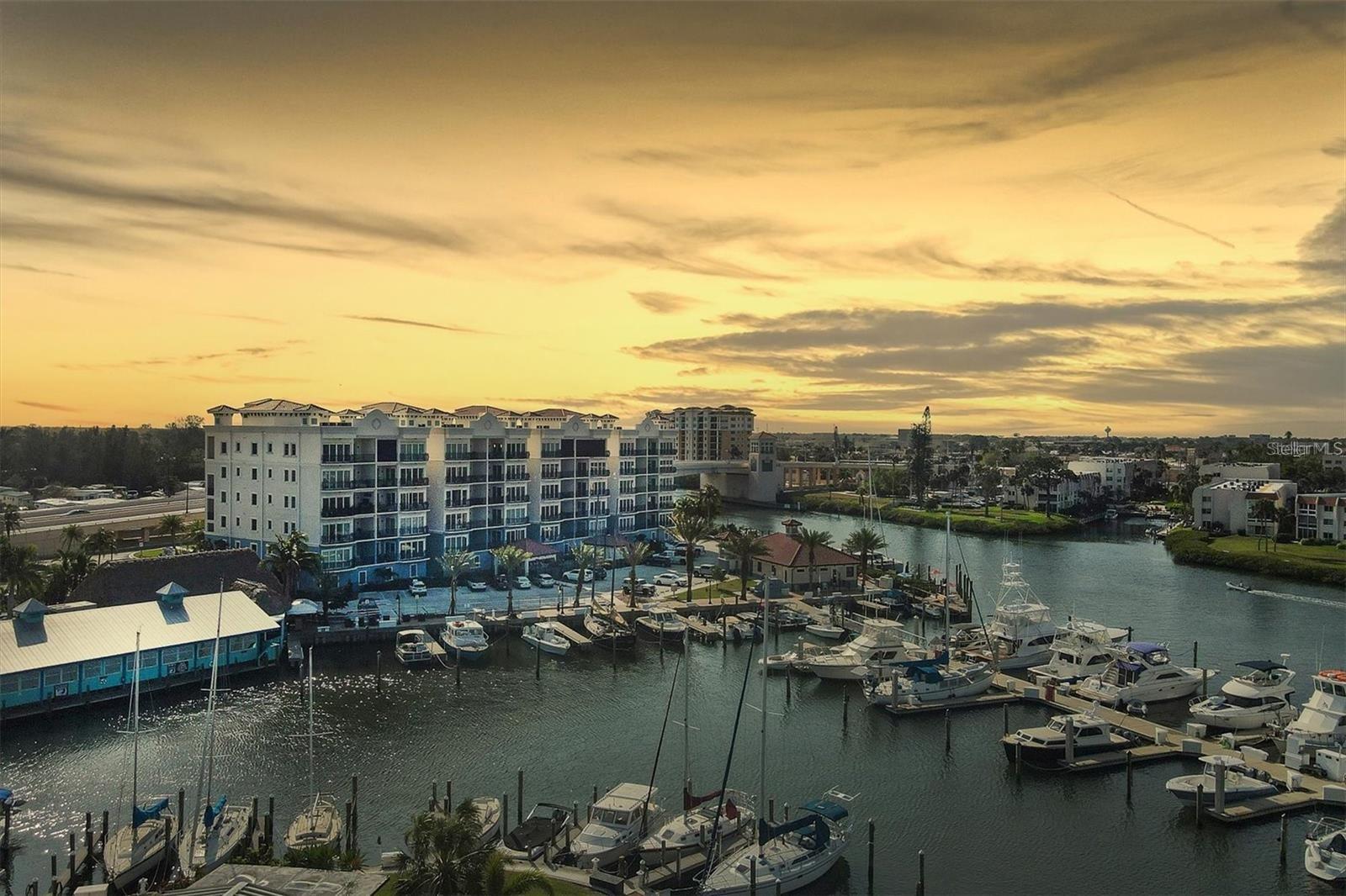Newly Constructed, NEVER Occupied, Luxury Condominium with panoramic views of the Marina, Intracoastal Waterway, and the Gulf of Mexico. The almost 2,000 sq. ft. residence offers 3 bedrooms, 2 bathrooms, 10’ ceilings, solid wood doors, crown molding, and plantation shutters. The large Kitchen has GE stainless steel appliances, quartz countertops, under cabinet lighting, custom exhaust hood, Timberlake solid wood cabinetry, an 11 ft peninsula, and an antique custom backsplash. Enjoy the amazing West Coast sunsets from your balcony off the great room. The Master Bedroom offers an over-sized walk-in closet and sliders to your private lanai. Inside the Master Bathroom there are two oversized vanities and a custom walk-in Roman shower. This unit comes with a one-car enclosed garage underneath the building for maximum privacy and has an abundance of parking available for all of your guests. A fully secured elevator and stairwell are provided from garage level to your designated living floor. Relax in the heated swimming pool with a cabana and poolside gazebo. Porto Vista is a custom designed, luxury, small, exclusive community with only 40 units and located in the heart of Venice. You are just a short walk away from Historic Downtown Venice, entertainment, shopping, restaurants, beaches, and golfing. This opportunity will not last long, call and schedule your private showing today!