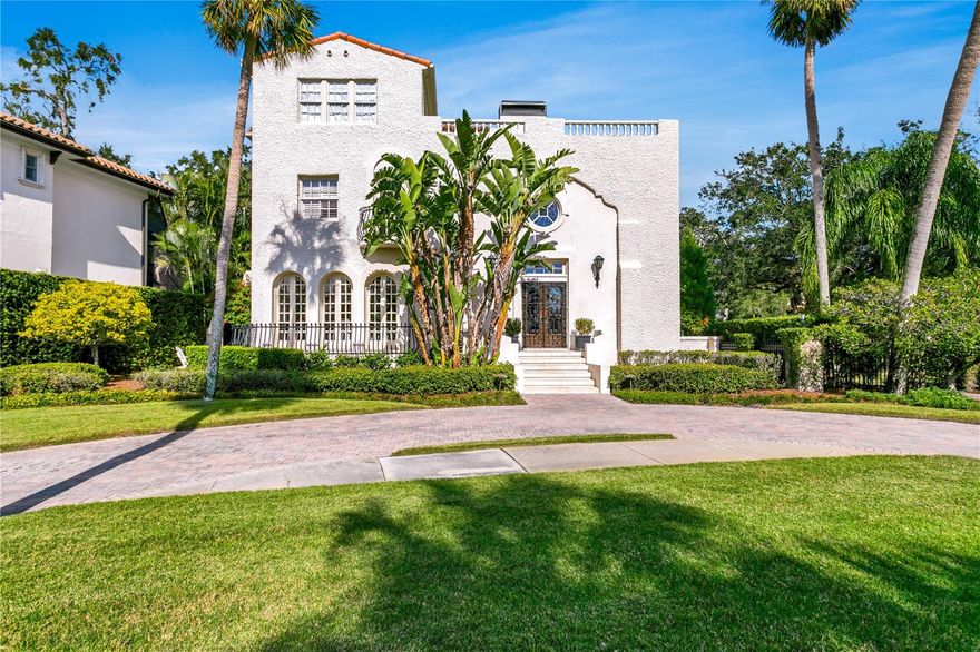 Welcome to this esteemed estate along Bayside Drive, where you’ll instantly feel as if you are stepping back in time to the fabled days of grand living along Tampa Bay’s iconic waterfront. A true reflection of days gone by, combined with modern updating, provides the perfect blend of flair and function in this stately home. Stepping through the gated front entry, you’ll immediately be drawn to the details that have delighted for more than a century. The dramatic vaulted living room with thick arched plaster doorways, Juliet balconies, and soaring coffered ceiling lure you in with drama and elegance. The stunning dining room is adorned with six sets of arched French doors with exterior views of Tampa Bay and an original plaster chandelier medallion that is a work of art. The sunroom invites natural light through arched windows to illuminate herringbone wood floors and provide views of the pool and grounds. The home’s finer details have only been improved upon with updated finishes that include wide plank hardwood floors, marble counters, and high end appliances. All rooms on the first floor are filled with natural light and flow effortlessly when entertaining. The kitchen is equipped for the most discerning chef and opens to the cozy TV area which features a pair of 6ft tall built-in wine fridges. Two stairwells lead you to the second floor where you will find the theater room complete with leather comfort seating for eight, three guest rooms, two baths, oversized laundry and spacious storage room. The main staircase then leads to the primary suite that encompasses the entire third floor. The updated bath includes marble finishes, a deep soaking tub, and glass-enclosed shower, while the dressing room offers an abundance of closet space. Just off the bedroom, you’ll find what may be your favorite part of the home…the private
observation deck with captivating views of the Tampa Bay. The home’s exterior is Gatsby-like with a pool and spa that is set perfectly, providing both privacy and cover, as well as a sunlit deck that wraps the property. The oversized corner lot allows you to enjoy the outdoor space without feeling the intrusion of neighboring properties. Bayside Drive is one of South Tampa’s most beautiful and highly sought after streets for both the quiet privacy and the water access that is afforded to homeowners. This estate comes with a dock and 10,000 lb boat lift, allowing direct access to the open waters of Tampa Bay. While this architectural gem is one of Beach Park’s original grand homes, it is at a higher elevation than other classic properties of its period. The charm of this home will captivate and delight you from first glance until the moment you call it your own.