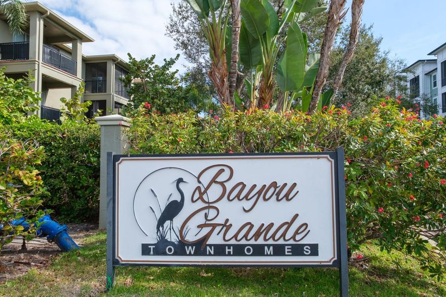 Available immediately for an annual lease! This beautifully maintained townhome is located within a private gated community and  features 3 bedrooms, 2 full bathrooms, and 2 half bathrooms. The thoughtfully designed floor plan includes multiple living areas, generous natural light, and ample storage throughout. Enjoy the convenience of a 2-car garage, perfect for parking, beach gear, and additional storage. Bayou Grande is a wonderful gated community offering  a swimming pool and cabana area, and located close to beaches, shopping, dining, and major roadways. Available for an annual lease, this townhome is an excellent opportunity for those seeking a long-term rental in a desirable location. First Month, Last Month, Security Deposit and cleaning fee required. Pets allowed upon approval.