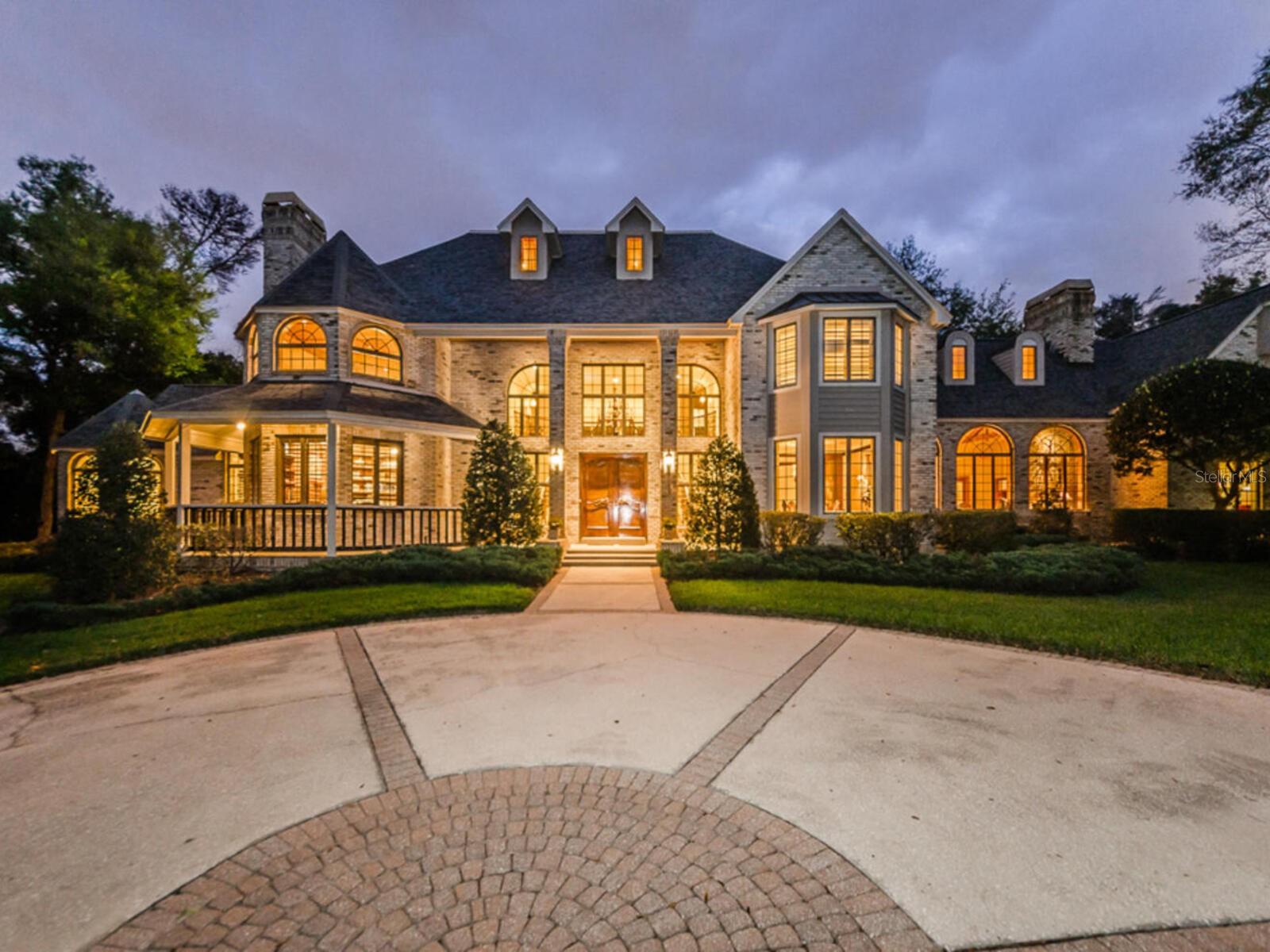Preview this beautiful home by video at the following link: https://shorturl.at/xtUXD
MAGNIFICENT GRANDEUR AND LUXURY. Towering trees and lush landscaping graced by a long sweeping concrete drive and Private Gated Entry is the ideal Welcome to this Extraordinary Estate on nearly 2.5 acres. Country feel yet minutes to shopping and dining. Experience the custom interior of over 6100 sq.ft. designed with world class craftmanship, elaborate detail, elegant finishes and amenities, plus over 1000 sq.ft in the Guest Home. Light filled living spaces with high ceilings and abundance of natural light. Beautiful Chef's Kitchen for creating all your culinary delights and includes Viking Gas range and Griddle cooktop, Bosch Dishwasher, and Sub-zero Refrigerator. Breakfast Room overlooks patios, pool and treed acreage. Stunning Library with Fireplace and elegant custom designed hardwood built-ins. Upper level Media Room, or Quest Quarters with Kitchenette and full bath. Magnificent Master Suite with separate sitting room and fireplace overlooking picturesque gardens, waterfall, and pool. Spacious Master Bath with His and Her separate custom designed walk-in closets, walk-in glass enclosed shower, and separate stand alone tub. Newer professional Work-out center and Gym with its own mini hair salon area. Walk through the lighted gardens and pool patio to the Guest Home with over 1000 sq.ft. featuring 2 bedrooms, bath, full kitchen, living room, dining room and sunroom with 1 Car Ac garage and its own private pavered patio and garden area. For the CAR ENTHUSIAST, 2 car garage attached to the main home, 5 car sep. garage building with 3 of the garages converted to an airconditioned Workout Center/Gym and Hair Salon area. 1 car AC garage attached to the Guest Home., Newly painted , Newer premium leaf filter gutters on main home and Guest Home, Newer AC"s, New pool pumps, New irrigation systems, New Pool Deck, and Newer bath renovations. New electrical on well pump. Private secluded pool and terrace area is ideal for entertaining and comfortable living. Massive family room with Brick fireplace , wood mantle and built-ins. Plenty of room for the pool table. Enjoy the walk-in Bar overlooking the screen enclosed patio area. Formal Living Room and Entry Foyer with Marble floors and double formal wood staircase and balcony. Treat yourself to your favorite coffee, latte or expresso in the Coffee Bar off the kitchen. Formal Dining Room with Wood Floors. This property has plenty of room for your own tennis court, or pickleball court and more. Secluded and private. Fenced yard. Total renovations in 2010 through 2011 the main home and Guest Home. The 7 bedrooms and baths include the Guest Home bedrooms and Bath. Additional upgrades and features include .Customed designed Wood Moldings around Windows, Arched doorways, and all doors. 8 inch designed Baseboards. Lots of SPACE, SECLUSION, AND TOTAL PRIVACY.