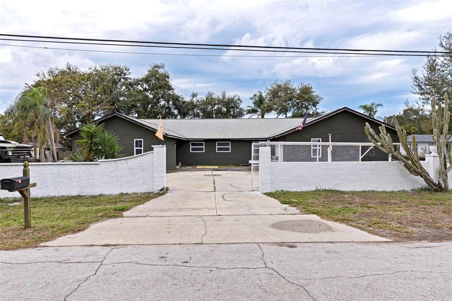 Welcome to The Compound! Must see 4 Bedroom, 2.5 Bath Pool home with oversized 2 Car Garage offers a workshop with mini-split AC (could be 3 car garage). Plenty of room on this 0.35 acre property to stretch out with all your toys and equipment. Situated across from Northwest Park and walking distance to Pelican Golf Course in Belleair. Kitchen has ample amount of cabinet space with granite countertops, high-top bar, gas Summit range top including stainless steel ventilation hood, Summit built-in oven and LG dishwasher (2025). Dining area seats up to 10 with French doors leading out to backyard. Huge laundry room with 1/2 Bath and pool access giving lots of storage with gas LG dryer (electrical hook-up offered). Master Suite has over 250sqft of privacy and a 7x14' walk-in closet with 16.4" ceiling. French door access to pool and backyard. Double sink with 4x6' walk-in shower with bench that includes 2 rain maker shower heads. Original Home was remodeled and completed in 2021. Vaulted ceilings (16.4 foot) throughout the home. Over 2400sqft. Home boasts 6" of spray foam insulation in-between all interior and exterior walls and ceiling including the garage. Over 600sqft of open concept living space perfect for entertaining friends and family. Tile flooring throughout home. Plenty of natural sunlight. Home features two tankless water heaters with one servicing kitchen and the other hosts laundry and baths. 250 gallon propane tank on site in-ground. HVAC (2021 Goodman 14 ser 5 ton). 2026 Exterior paint and soffit. Hurricane rated double pane windows (2020). Cat5 coax cables for internet hook-up. Entire property is fenced in. RV, boat and trailer parking. Gated property with space to move and store equipment on both sides. Complete with 8 Security Camera Zones. All exterior walls were rebuilt with 2X6 boards. 3 separate electrical panels. Main panel 200 amp has arcfault GFCI. Outdoor panel has room for outdoor kitchen install. 10x10 metal work shed with windows and electrical hook-up. In-ground pool with spa (2019) pump, filter housing (2024). 3 miles to many of the top rated beaches in the US. 30 mins to Tampa airport and 15 mins to St Pete/Clearwater airport. 42' RV camper in backyard can stay or be removed. Needs TLC. Seller was going to turn it into a bar for entertaining. Has altered 10x16ft custom bedroom for additional room. Can be updated as a recreational outdoor space, in-law suite, office or short-term rental. Schedule your showing today. Don't miss this one!!