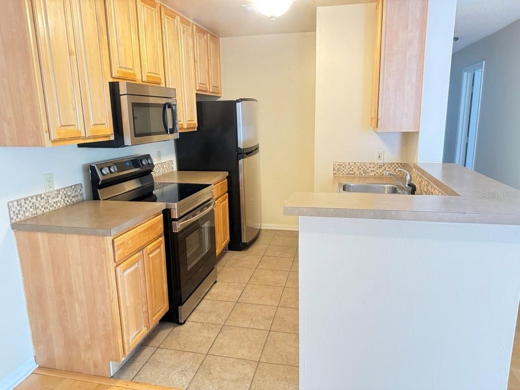 Photo of 6088 Westgate Drive #203, Orlando, FL 32835 (MLS # O6424326)