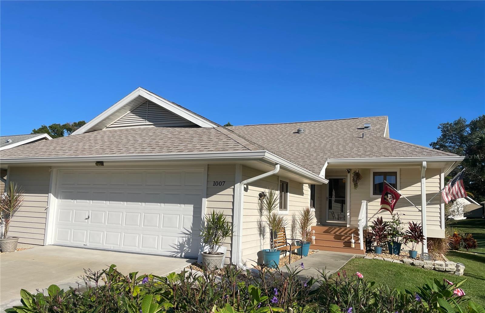 THIS HOME IS FULLY UPDATED & LOCATED IN THE BEAUTIFUL RESORT - STYLE SOUTH POINT ALEXIS COMMUNITY, WHICH IS GOLF CART FRIENDLY, WITH POOL & TENNIS COURTS. FEES also include cable TV, internet, sewer, trash pickup, lawn maintenance, weeding, trimming, WATER (irrigation water & house water,) sewer, & trash! Recreational amenities include a large resort size heated pool and spa, tennis courts, basketball court, shuffleboard and pickle ball courts! Clubhouse offers a lovely environment for entertaining, indoor & outdoor lounging areas, an exercise room, ping pong, billiard room and a full kitchen!
This light and bright beautiful 2-bedroom, 2-bathroom, home has an open air/closed Florida room that is heated/AC for a possible 3RD bedroom or family room. The home features a stunning new kitchen with granite countertops, subway backsplash, shaker style cabinets and new appliances. All new flooring consists of 24x24 porcelain tile throughout the home accented by new slate tile in the Florida room. From the kitchen you will be met by a cozy breakfast nook with a window to the outside to take in the natural beauty - a perfect place to enjoy your morning coffee and relax. The kitchen opens up to the formal dining room and spacious living room. The upgrades continue into both baths with new granite countertops and cabinets; new hardware throughout, as the master bath features dual sinks and walk in shower with tumble tile. You will see the meticulous details of each upgrade throughout this home with the following being done in 2021: roof, solar tubes for extra lighting, fans, 6" gutters and downspouts, interior and exterior house paint, trees/landscaping, water softener system, new driveway, several hurricane rated windows. The house features a unique two 1/2 car garage with lots of storage, and electric garage door opener. Take advantage of the huge storage space beneath the house ideal for storing kayaks, ladder, etc! The house offers access to Lake Avoca to the Gulf of America right across the street. Nearby to Fred Howard Park and Beach, along the Gulf of America! The Pinellas Trail, quaint downtown & Sponge Docks of Tarpon Springs, featuring unique shops, local restaurants, golf courses, numerous urgent care clinics and Advent Health North Pinellas Hospital are all nearby! Make this your home before it's gone.