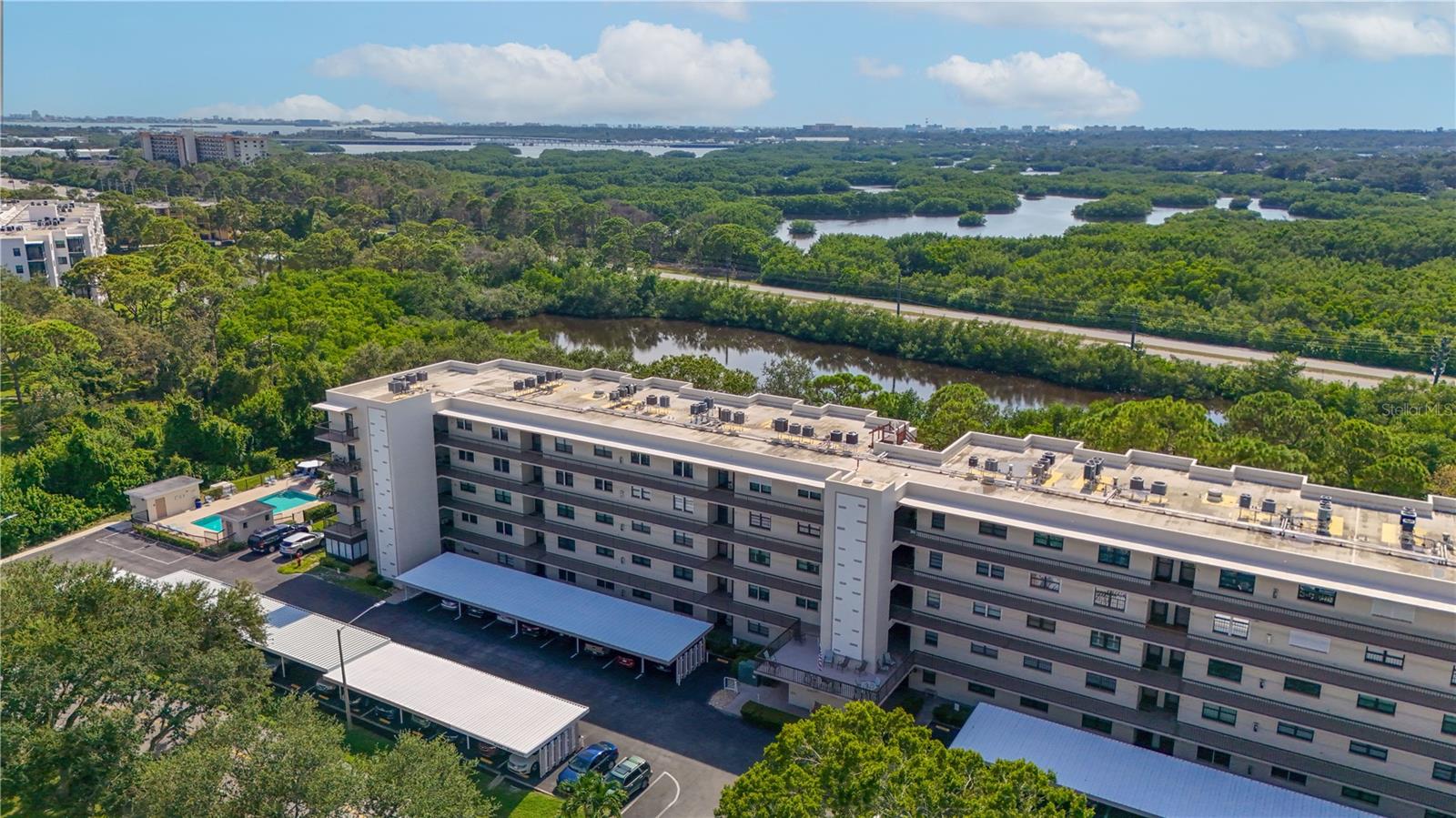 Welcome Home to this IMMACULATE/Clean As A Whistle 2/2 unit with Breathtaking and Tranquil views of the Lake and Bayou! This Building/Community remained unscathed from last years stoms - NO ASSESSMENTS! This unit is located in the highly sought after Radcliff Building, and is one of the largest units in Five Towns! Outstanding floor plan - complete with 2 bedrooms, 2 full baths, a large galley kitchen, a family room, dining room, living room and 8X10 foot storage/utility room, and spacious lanai! You can actually have TWO – Ensuite Units within this floorplan! Master bath was more recently remodeled. NEW 2020 - A/C & Heat installed with 10-year warranty! Master bedroom has walk-in closet that is 5 ft by 10 ft and sliders to a screened lania with peaceful views of the lake and bayou…along with custom fit sunscreens, to enjoy the lanai year round. You will love the enjoyment of a gas stove in the kitchen to prepare all your special dishes along with lots of counter space. Natural gas is included in the condo fee and services the gas stove, gas heat and gas water heater. Five Towns is an active 55+ community with countless planned events and social clubs, 6 pools, tennis courts, bocce ball court and so much more! Located close to shopping, restaurants, beaches and 25 minutes to the airport. Call today to schedule your private showing!
