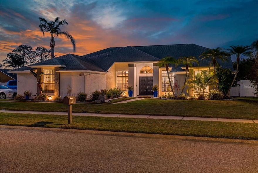 Welcome to this beautifully renovated 3-bedroom, 2-bathroom pool home located in the desirable Wyndtree community near Trinity. Thoughtfully designed with an open-concept layout, this home features luxury vinyl plank flooring throughout and stylish upgrades at every turn. The inviting living room serves as the heart of the home, showcasing a modern electric fireplace with a chandelier accent, creating a warm and elegant gathering space. Just off the living area is a dedicated office space, ideal for working from home or managing daily tasks. The centrally located kitchen is perfect for both entertaining and everyday living, featuring quartz countertops, stainless steel appliances, a cooking island, and a breakfast bar that flows seamlessly into the dining area. A bright bonus room with panoramic windows and beautiful pool views fills the space with natural light and provides additional family or entertainment space. The primary suite offers a relaxing escape with a walk-in closet featuring built-in storage, direct access to the office space, and a beautifully updated ensuite bathroom with a separate tub and shower and dual vanities. The home features a split-bedroom floor plan, with two spacious secondary bedrooms located on the opposite side of the home along with a fully renovated guest bathroom. Enjoy your private backyard retreat featuring a pavered pool deck and heated pool, perfect for year-round enjoyment and outdoor entertaining. Additional highlights include a garage with refinished floors, ample parking space, and generous storage, plus a laundry room with built-in shelving and a utility sink conveniently located just before the garage entry. This move-in-ready home combines modern updates, flexible living spaces, and a resort-style backyard—all in a fantastic location near shopping, dining, and top-rated schools in the Trinity area.