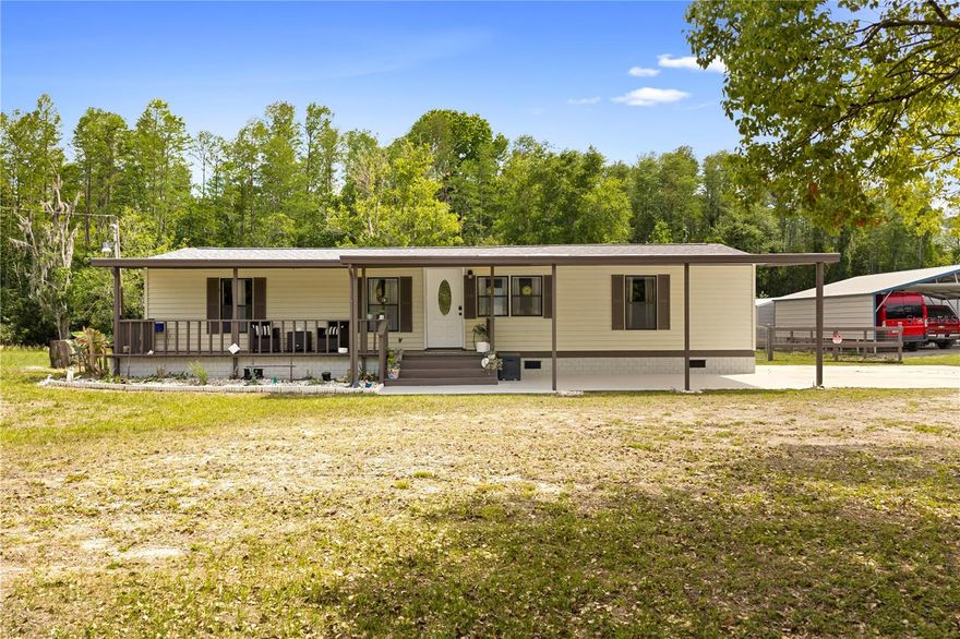 Nestled at the end of a quiet dead-end street, this beautifully charming renovated home with income potential, updated manufactured home sits on a spacious 1.30-acre lot, offering both privacy and opportunity. Whether you're looking for a comfortable residence or an income-producing property with Airbnb potential, this home delivers flexibility and value.

Inside, you’ll find a bright, refreshed interior featuring new tile flooring throughout and fresh paint inside and out. Major updates include a recently replaced roof, a well-maintained septic system serviced in 2025, and an A/C system updated around 2019 for dependable year-round comfort.

The home offers three generously sized bedrooms, providing plenty of space to relax. A large enclosed sunroom/lanai adds versatile living space—perfect for a home office, studio, or additional lounge area.

Outdoors, the property continues to impress with NO HOA restrictions, giving you the freedom to make it your own. Two RV parking pads with hookups (30-50 amp) for added convenience and excellent potential for additional rental income. A large shed with washer and dryer simplifies laundry, while a separate tool shed provides extra storage.

Ideally located near Gulf-side recreation, you’ll enjoy easy access to activities like kayaking, paddleboarding, fishing, and even swimming with manatees. Nearby trails for scenic hiking and biking, while local shops and restaurants are just a short drive away.