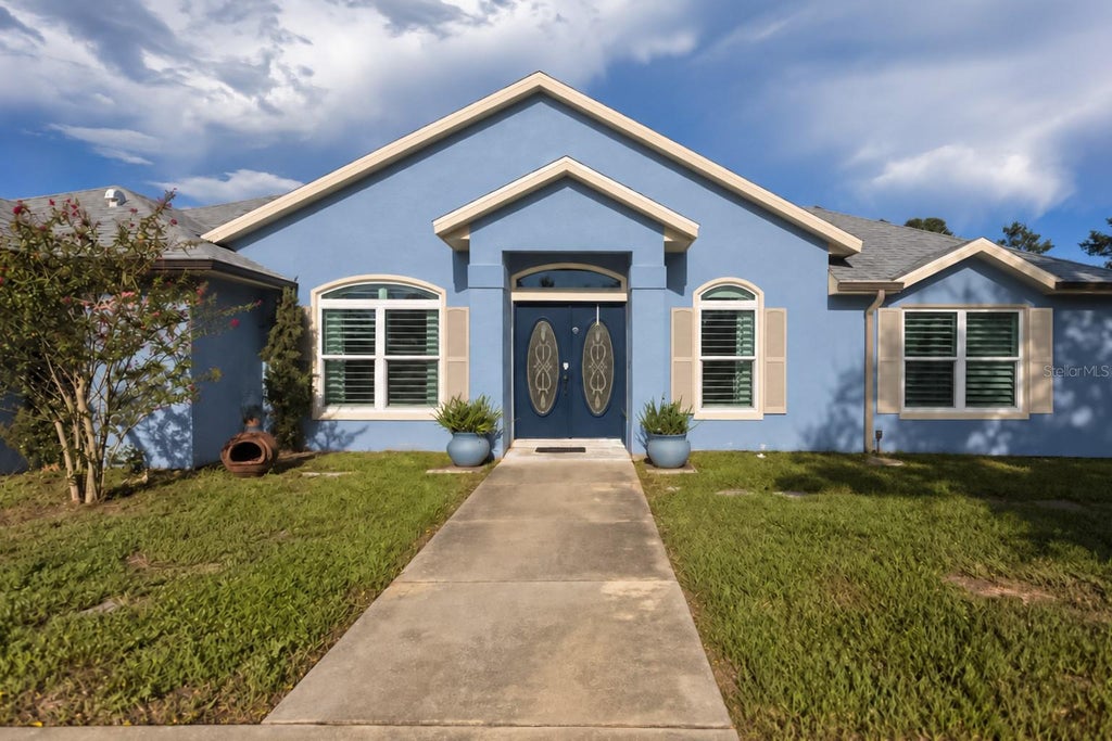 Photo of 2146 Puerto Rico Drive, Deltona, FL 32738 (MLS # O6442815)