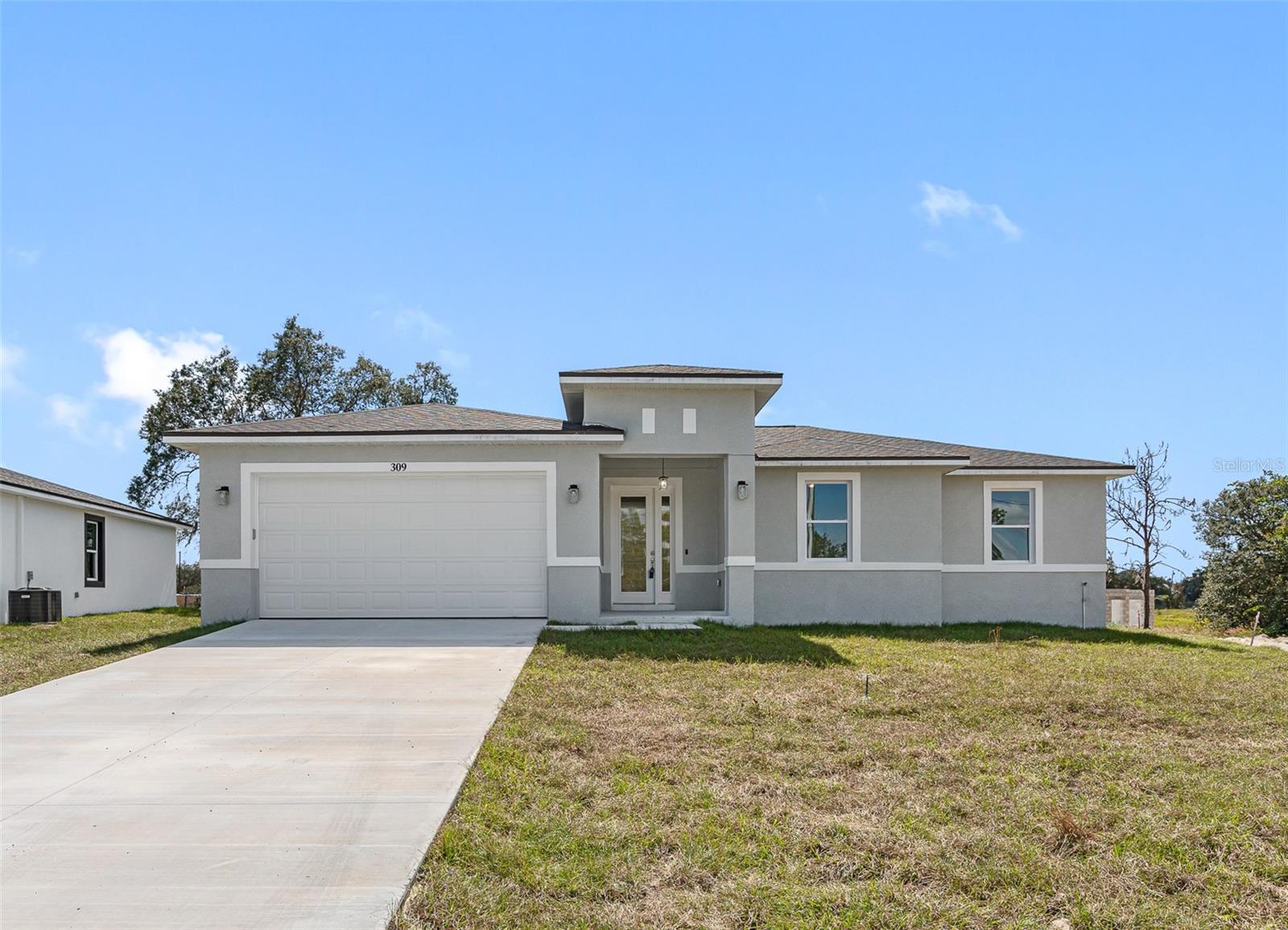 This beautiful 3-bedroom, 2-bathroom home features a spacious, open floor plan, ideal for both relaxation and entertaining. The kitchen boasts Quartz countertops, soft-close cabinets, and sleek vinyl flooring throughout. With vinyl impact windows, an 8-foot entry door, and a stem wall foundation, this home stands out for its durability and elevated design. The master suite features a walk-in closet and an en suite bathroom. Plus, the seller is offering up to $5,000 toward closing costs!!! Making it an ideal choice for buyers looking for a move-in-ready home with modern finishes. Schedule a tour today!