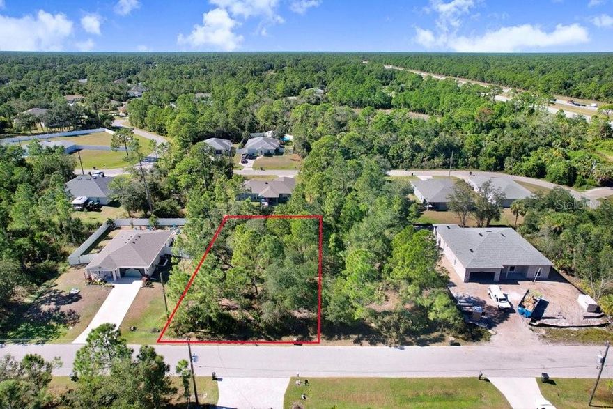 Opportunity knocks on this nicely wooded residential lot surrounded by attractive homes and new construction. Tucked on a quiet street with a natural buffer behind, you’ll enjoy extra privacy while staying minutes from shopping, dining, parks, and quick access to I-75 for easy commuting. Electric appears nearby—buyer to verify all utilities and building requirements. No HOA or CDD reported. Build now or hold as a land investment in one of Southwest Florida’s fastest-growing cities.