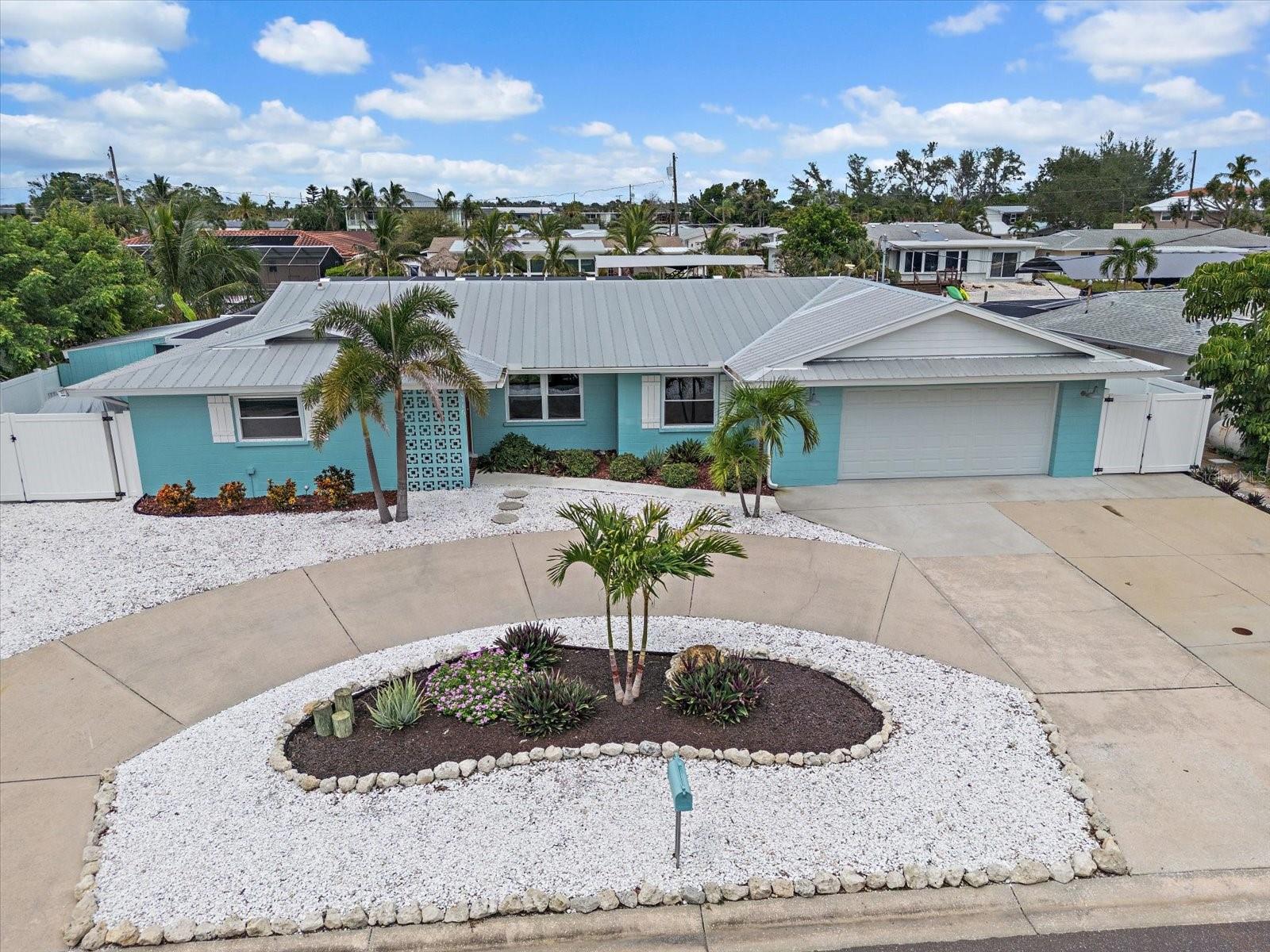 Live like you're on vacation in your very on slice of paradise! This wonderfully maintained waterfront home is located in the highly desirable Flamingo Cay community that is located just 3 miles from the stunning beaches of Anna Maria Island and is just a short drive the the world-renowned IMG Academy. The home offers canal front living with two remote boat lifts (up to 10,000 lbs and up to 7500 lbs) with direct access to Palma Sola Bay, the Gulf and is just a short boat ride to the scenic Robinson Preserve. This home did NOT flood and did not suffer any damage from the recent storms and is protected by a new vinyl seawall that is warranted for 60 years providing priceless peace of mind! This home has numerous upgrades and updates and as you walk in the front door you will enter in an amazing great room filled with abundant natural light that has direct views and access to your very own salt water pool and waterfront backyard. The great room which is the perfect place for entertaining is contains a spacious living room with an amazing kitchen that offers custom cabinetry, granite countertops, commercial grade appliances, ice maker, wet bar, an enormous center island and so much more. The primary suite offers a custom walk-in closet with custom closet system and a STUNNING spa-like owner's bathroom has a beautiful custom vanity, dual shower and gorgeous tile work. The second spacious bedroom has a built in king sized Murphy Bed and many custom features. Outside you will enter your very own private oasis with a sparkling salt water pool, incredible screened-in pool/patio area and water access that would fulfill every boat lovers dream with a large dock with water and electric. Outside also features a shed/workshop with electric and enough room to store and additional boat/vehicle in a private fenced side portion of the yard. The oversized garage is currently set up as an amazing man cave and has custom flooring, a split AC system and tons of room for all of your toys! HOA is optional. LOVE WHERE YOU LIVE!!