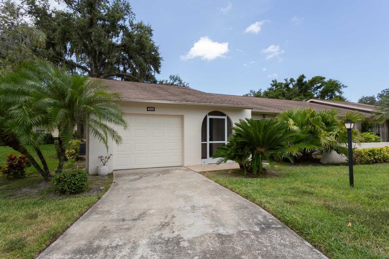 Welcome to this beautifully updated 2-bedroom, 2-bathroom villa in Oakhurst, one of Sarasota’s most sought-after 55+ communities. Nestled on a lush, tree-lined lot with expansive greenery on the front and side, this 1,543 sq ft home offers the perfect blend of modern comfort, low-maintenance living, and an active adult lifestyle. New Pella Impact Windows for Hurricane peace of mind. Newly updated kitchen and bathrooms, 2016 HVAC with new A/C ductwork and added insulation in 2023. Freshly painted from top to bottom, this villa features a bright, open floor plan with neutral tile flooring throughout. The spacious family room flows seamlessly into the fully remodeled kitchen, showcasing granite countertops, beautiful cabinetry, stainless steel appliances, ample pantry space, and a separate laundry room with a washer/dryer and convenient folding table.
The dining room features charming beamed ceilings and opens to a screened-in patio—ideal for relaxing or entertaining. The primary suite includes a large walk-in closet and an updated ensuite bathroom with granite counters and a sleek glass-enclosed shower. The second bedroom has dual closets and is adjacent to another tastefully updated full bath with a granite vanity and tub/shower combo.
Additional highlights include: An attached garage with built-in storage cabinets. Hand-textured orange peel walls and ceilings. ALL NEW lighting, ceiling fans, doors and hardware, baseboards, water heater, bathroom vanities, plumbing fixtures, and closet systems.
Life at Oakhurst: A True Florida 55+ Retreat. Oakhurst is a scenic, wooded active adult community designed for those seeking a vibrant and social Florida retirement. Residents enjoy a low-maintenance lifestyle with HOA-covered exterior maintenance, including landscaping, roof care, and common areas.
Amenities include: Heated outdoor pool with glass-panel wind protection, Spacious clubhouse with kitchen, media center, fitness room, library & billiards room, Shuffleboard courts, picnic area, and gazebo under mature oak trees, Weekly Tai Chi and water aerobics classes, Social events, holiday parties & gatherings organized by the community committee. Oakhurst’s attached villa homes provide the ideal alternative to single-family houses, with architectural variety, ample living space, and 1- to 2-car garages.
Prime Sarasota Location, Perfectly situated in central Sarasota, Oakhurst is: Less than 5 minutes from shopping, dining, CVS, and Winn-Dixie, Close to Urfer Family Park and medical facilities. Minutes to I-75, Downtown Sarasota, and world-class beaches on the Gulf. Just over an hour to Tampa and Tampa International Airport. Whether you’re downsizing or simply seeking a peaceful, social place to enjoy retirement, this move-in-ready villa in Oakhurst offers the best of Florida’s 55+ lifestyle—without sacrificing space, comfort, or convenience.
Schedule your private showing today!