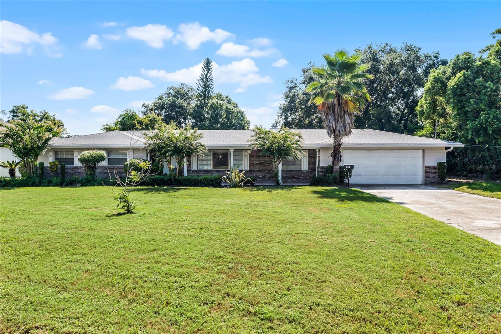 Rare Gem! This lovely 4-bedroom, 3 bathroom pool home with two en suites is sure to be snatched up in a hurry. Located on crystal clear Rock Lake in Orlando and boasting a fabulous downtown city view, this home is not something that comes along every day. Upon entering you’ll find a spacious foyer and to your right, a private living room leading to a dining room right off the kitchen. The island kitchen has granite countertops, stainless steel appliances and lots of cabinet space. An adjacent laundry room with a large pantry and extra storage adds to the convenience. The opposite end of the kitchen has a roomy breakfast bar and leads to a huge family room with a wood burning fireplace and sliding glass doors leading to a covered lanai, large pool and a dock. What a beautiful place to entertain family and friends. Both en suites have large walk-in closets and one has sliding doors leading to the pool and displaying the lovely view of the lake and city. This home has an alarm system, an oversized 2 car garage and the washer and dryer are included. Located near Camping World Stadium and all of the amenities of the downtown Orlando area.