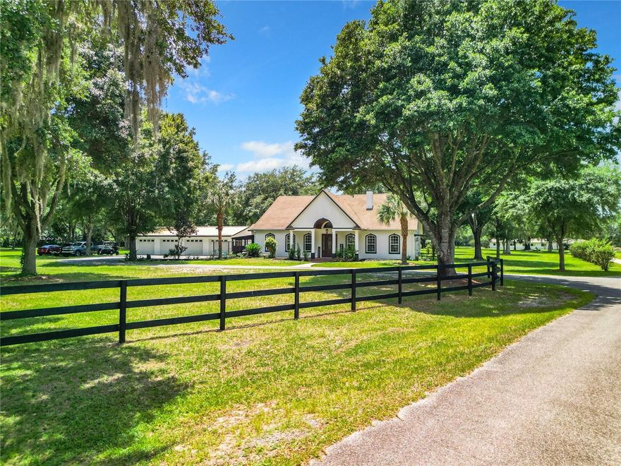 Welcome Home to this Magnificent Equestrian Estate. This property consists of 6 parcels totaling almost 84 acres. You will impressed the moment you approach the electric front gate and drive down the winding driveway with paddocks on each side, beautiful trees and landscaping as you come to the freshly painted main house with 3 beds 3 baths and detached 4 car garage. This home has so much to offer including an in-law suite, formal dining room with tray ceiling, crown molding throughout, large eat in kitchen with cherry wood cabinets, granite counter tops, huge island, NEW stainless steel double ovens, oven range, refrigerator, dishwasher, microwave and huge pantry off the kitchen. The family room has vaulted ceilings, recessed lighting and a double-sided wood burning fireplace. All the bedrooms are large with walk in closets. Come in from a busy day on the farm into the mud room with slate flooring for easy clean up, slop sink and storage cabinets. A brand-new sunroom was just installed where you can sit and enjoy coffee in the morning. In addition to the main house there is a small cottage with 1 bed 1 bath (needs tlc) and a beautifully updated pool house.  After a long day of taking care of the horses, sit back and enjoy time in the oversized 18 x 70' lap pool with a new 700lb sand filter.  The pool house (cabana) which is open floor plan has been updated with a beautiful kitchen with stainless steel appliances, huge island with granite countertops and recessed lighting. The open living space has a murphy bed and woodburning fireplace. Right off the kitchen is a gorgeous spa like bathroom. There is also a separate pool bath and storage room for all your pool floats and supplies. Now to all the fun stuff...This is a horse lovers paradise. The property is completely fenced with brand new 3 rail fencing. There are 12 huge paddocks (that can be divided into smaller ones) that have alleyways between them with gates. Each paddock has automatic waterers. There is also a 1 mile picturesque bridal path inside the circumference of the property. There are a total of 3 barns. The amazing L shape block wall barn with 18 stalls (2 are birthing) has 12-foot alley ways with ceiling and sconce lighting. Each stall is 12 x 12 ft and has grids on crushed limestone, insecticide sprayers, new self-waterers, fans and feeder trough. There is an office, sitting room, bathroom with hot and cold water, wash station, feed room with new roll up door and tack room. Outside the barn is another 6-stall barn with waterers and power.  Across the property is the 60 x 50' wood 10 stall drive through barn with loft that has 24' alley way.  Get ready for events with the 80 x 200 ft covered arena. This amazing arena is fully fenced, footing is 65% sand 35% clay for western riding, 24 high bay LED lighting, 3 zone stereo with PA system, mirrors and a brand-new grandstand. There is also a 60 ft round pen off the arena with a viewing station. Need a place for all your equipment, there is a 60 x 50 ft Quonset hut, a large storage building and separate workshop to fit it all. This magnificent property offers peace and privacy as well as limitless possibilities yet is just 35 minutes to the WEC, close to Salt Springs Marina, Lake Kerr and Silver Springs. Don't miss the chance to make this dream property yours.