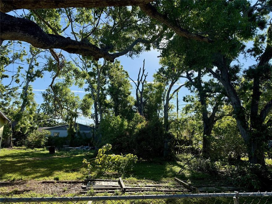 Wow! What a great value and at an amazing new price! Situated in the heart of St. Petersburg, this enchanting 5,800 sq. ft. corner lot is a rare find—a blank canvas awaiting your vision! Towering shade trees sway gently in the Florida breeze, offering a peaceful retreat while still being just minutes from the vibrant energy of downtown St. Pete, bustling shopping districts, and quick access to the interstate for easy travel. With utilities nearby and a prime location outside the flood zone, this lot is truly ready to bloom into something extraordinary. Imagine sipping morning coffee on a sun-dappled porch, hosting twilight gatherings under the rustling leaves, or designing the home you’ve always dreamed of. Opportunities like this don’t last long—come plant your roots in paradise!