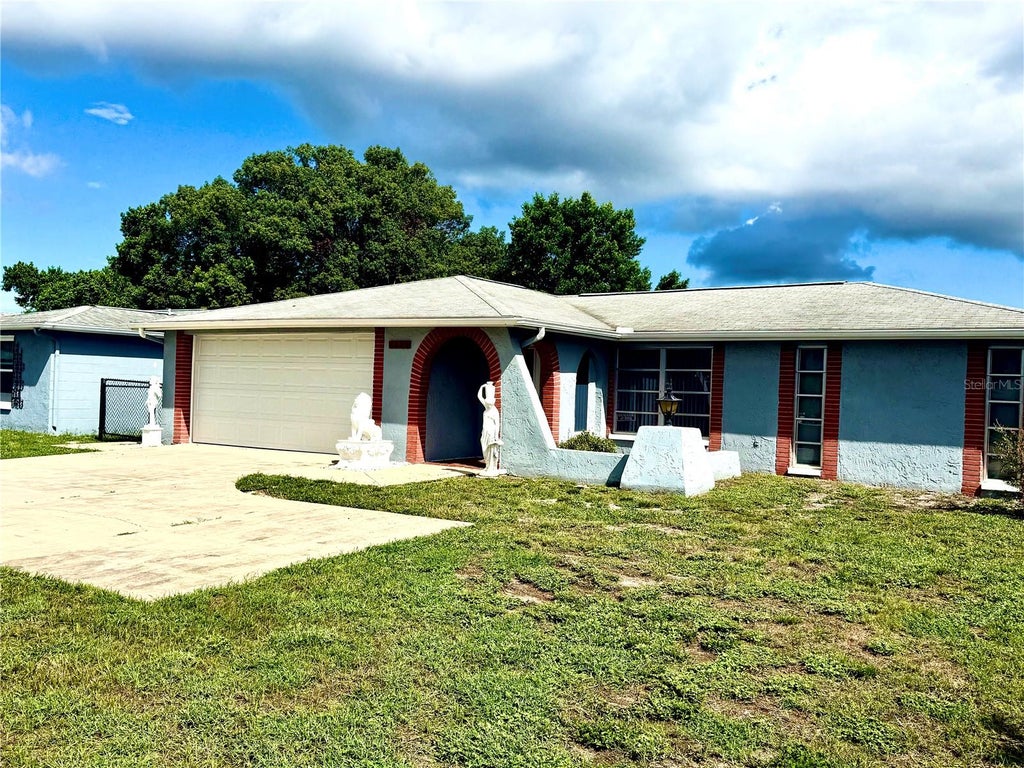 Photo of 7625 Embassy Boulevard, Port Richey, FL 34668 (MLS # TB8552976)