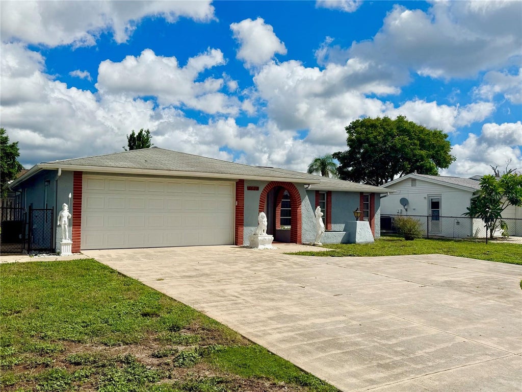 Photo of 7625 Embassy Boulevard, Port Richey, FL 34668 (MLS # TB8552976)