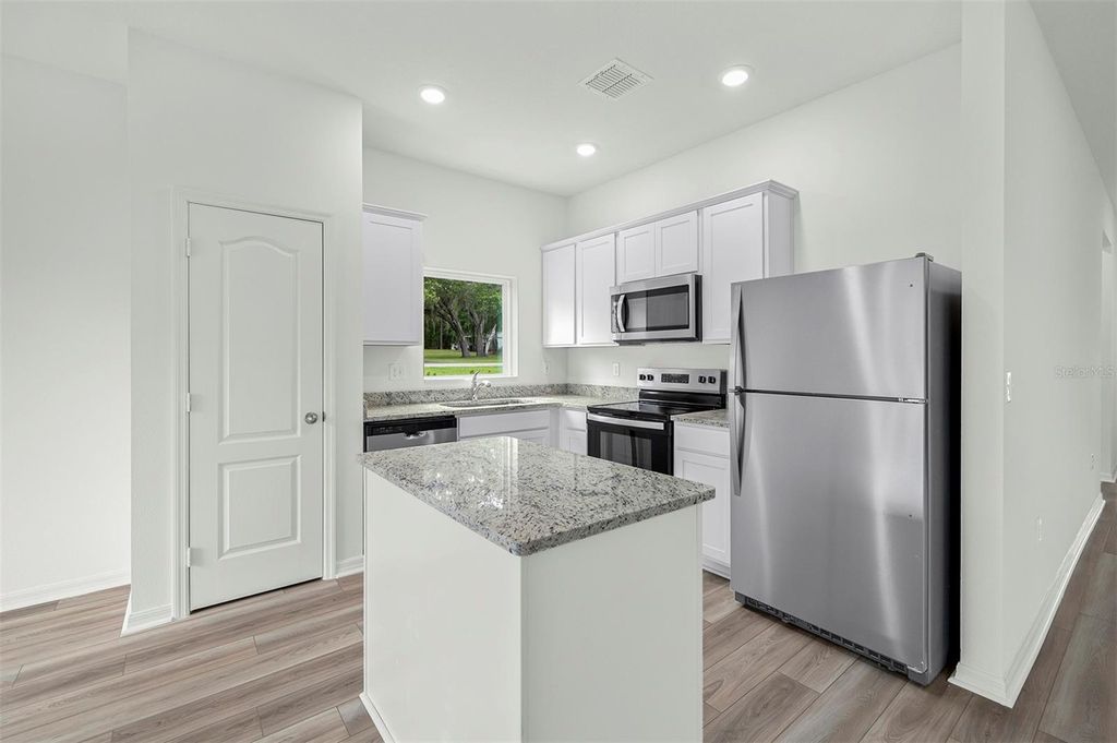 Photo of 13340 Tula Loop, Astatula, FL 34705 (MLS # TB8491048)