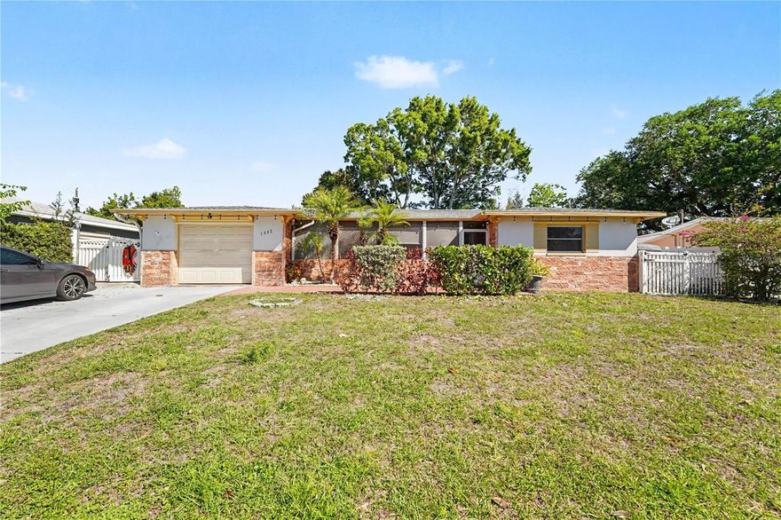 One or more photo(s) has been virtually staged. Welcome to your beautifully updated Clearwater retreat, where comfort meets style in all the right ways. This 4-bedroom, 2-bathroom home offers a thoughtfully designed layout with modern upgrades throughout, making it truly move-in ready. Step inside to find stunning luxury vinyl flooring that flows seamlessly through the home, complemented by abundant natural light and ceiling fans in every room for year-round comfort. The fully remodeled kitchen is a standout feature, boasting sleek granite countertops, ample cabinet space, stainless steel appliances, and a clean, modern design perfect for both everyday living and entertaining. Both bathrooms have been tastefully updated, offering a fresh, contemporary feel. The enclosed Florida room has been converted into a versatile office space—ideal for working from home, a playroom, or a quiet retreat. Outside, enjoy an oversized lot with a fully fenced backyard, providing privacy and plenty of room to relax or entertain. The addition of backyard pavers creates the perfect setting for outdoor gatherings, dining, or simply unwinding in your own private oasis. Located in the heart of Clearwater, and located near top rated beaches, dining and shopping, this home combines modern updates with functional living spaces and a fantastic outdoor setup—an opportunity you won’t want to miss. 
Click the Virtual Tour link to view the 3D walkthrough. Discounted rate options and no lender fee future refinancing may be available for qualified buyers of this home.