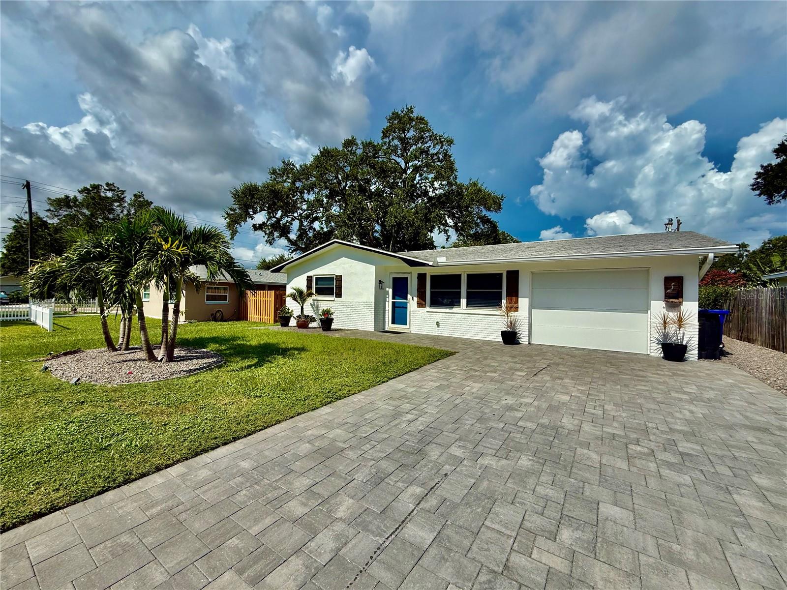 Thoughtfully updated 2/2 residence, offering a truly move-in ready rental opportunity. No flooding or any damage during previous storms. Step inside to discover beautiful terrazzo floors, an inviting open layout, and spacious bedrooms designed for comfort. The completely remodeled kitchen is a chefs dream, featuring custom cabinetry, durable Dekton countertops, stylish backsplash, modern appliances, and added storage all centered around a cozy eat-in dining area perfect for everyday meals. Enjoy seamless indoor-outdoor living with new sliding glass doors leading to an air-conditioned Florida room ideal for morning coffee or quiet relaxation. Extensive upgrades include full interior and exterior painting, updated flooring, a renovated bathroom, smart switches and thermostat, upgraded lighting and ceiling fans. Outside, the beautifully landscaped yard features brick pavers, a custom shed, creating an inviting outdoor space. There is also a half bathroom in the garage for your convenience. Located just two miles from vibrant Main Street and steps from The Dunedin Golf Club, The Community Center, The Art Center, Honeymoon Island, and The Pinellas Trail, this classic Dunedin charmer offers the perfect blend of location and lifestyle. In addition to the advertised base rent, all residents are enrolled in the Resident Benefits Package (RBP) for $50.00/month which includes HVAC air filter delivery, credit building to help boost your credit score with timely rent payments, utility concierge service making utility connection a breeze during your move-in, and much more! More details upon application. Home can come furnished or unfurnished for the same price! One pet welcome, 100 lbs max. One year of internet is included in rent. Vacant and Available now! Once approved, tenant can move in within 2 weeks.