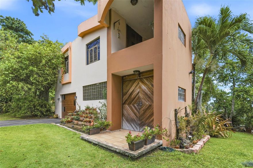 Beautiful custom-built two-story home in the desirable Fortuna area of Luquillo, ideally located near Luquillo Beach, the famous kiosks, Hacienda Carabalí, El Yunque Rainforest, and major road access. This prime location offers the perfect blend of convenience, tourism appeal, and tropical lifestyle.

This spacious property features 3 bedrooms, 3 bathrooms, inviting living and dining areas, a well-designed kitchen, and a welcoming foyer. The lower level adds exceptional versatility with a garage, private office or library, workshop area, laundry space, and a large family or guest room with its own bathroom and kitchenette—ideal for extended family, private guest quarters, or potential multifamily/income-producing use.

Enjoy outdoor living with an attractive gazebo perfect for entertaining or relaxing. With ample space, flexible layout, and an unbeatable location, this property is an excellent opportunity as a primary residence, vacation home, or investment in one of Luquillo’s most sought-after areas.