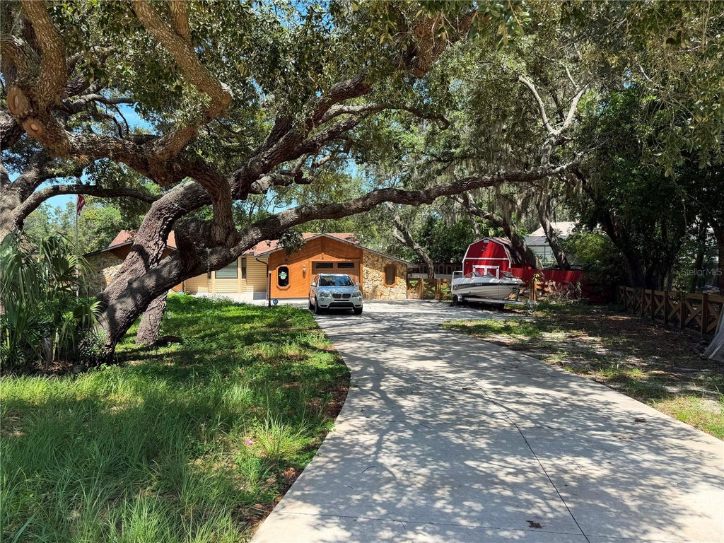 Photo of 325 Gulfport Lane, Spring Hill, FL 34608 (MLS # TB8531764)