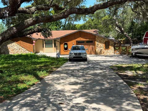 Photo of 325 Gulfport Lane, Spring Hill, FL 34608 (MLS # TB8531764)