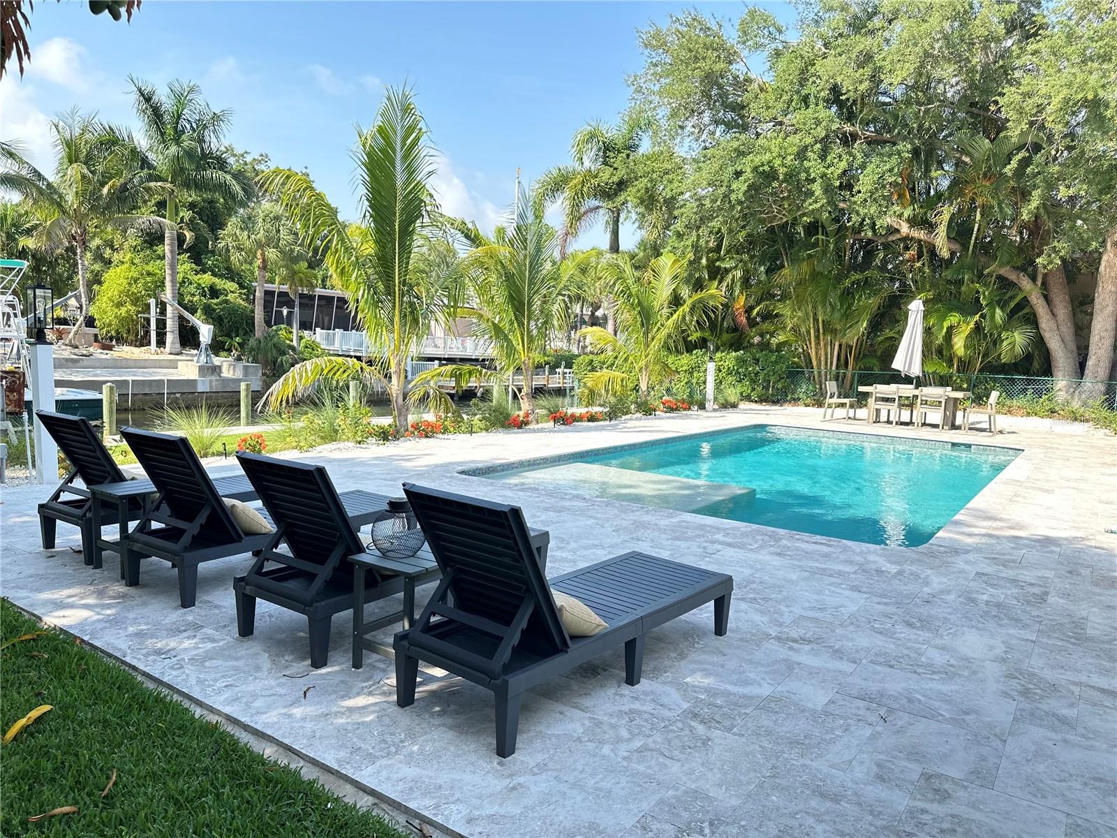 Embrace the epitome of upscale waterfront living in this fully remodeled, furnished 3-bedroom, 2-bath home nestled on a serene canal just off Sarasota Bay. With a private boat dock and direct bay access you can launch your Kayak or Paddle Boards directly from property and enjoy quick access to Sarasota Bay. Bring your Boat or RV. Fenced parking for RV on side of house and Davits for your boat. This stunning property offers an unparalleled lifestyle opportunity, a boater's paradise!
Inside, every detail reflects luxury and comfort, starting with the open floor plan that provides panoramic water views of 100 ft of canal view. Sliding doors provide access to outdoor living space and view of the canal. Large windows enhance the spacious feel, while luxury vinyl flooring adds elegance and durability throughout the home. The gourmet kitchen is a chef’s delight, featuring state-of-the-art stainless steel appliances, granite countertops, and a sleek breakfast bar.
Step outside to discover a beautifully designed pool area, uncaged for flawless integration with the surrounding waterways. Enjoy seamless indoor-outdoor living with stylish high-end furnishings that make every corner inviting. Covered Patio and Grill area. The deck and garden area, complete with tropical landscaping, offers a perfect setting for entertaining or quiet relaxation.
Located on the mainland side of Intracoastal waterway just north of the South Siesta Key Bridge, this home is just minutes away from top-tier dining, shopping, and cultural attractions, combining peaceful waterfront living with city conveniences. Only a 5-minute bike ride to the world renown #1 Siesta Key Quartz Crystal white sand beaches.
This fully furnished home is ready for you to move in and start enjoying a life of luxury and tranquility. Don’t miss out—schedule your visit today and see what makes this Sarasota Bay property a dream come true and why everybody is asking "what's all the fuss about Sarasota! TURNKEY -Includes all utilities, Lawn and Pool service. Currently Leases through Dec 2025. Available as Short Term Lease Jan 2025 forward. Taxes not included for Short term Lease. Long Term Lease can be discussed.