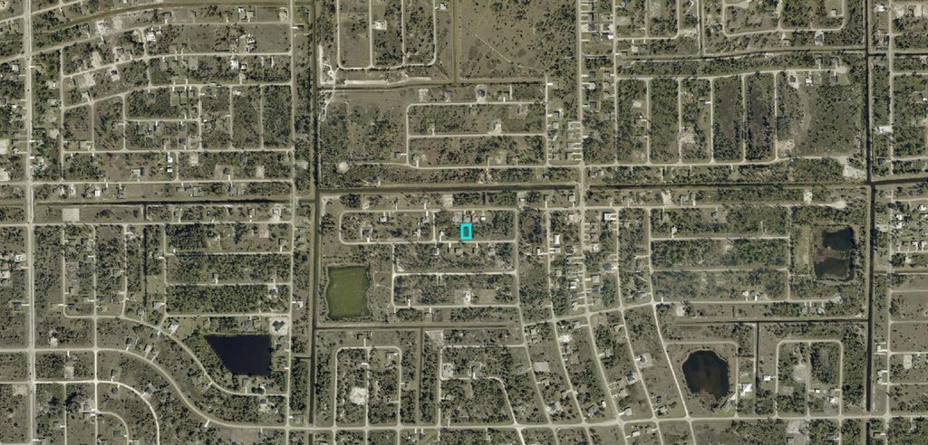 Photo of 941 Panda Drive, Lehigh Acres, FL 33974 (MLS # A4687137)