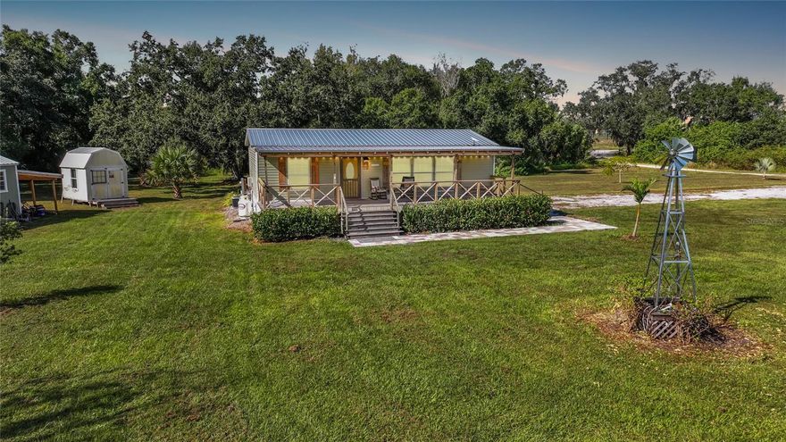 Welcome home to wide open spaces and peaceful privacy! Tucked away behind a tree-lined property line and a gated entrance, this 10-acre slice of country paradise is everything you’ve been dreaming of. Zoned agricultural, it’s perfect for anyone wanting to bring their animals, build a hobby farm, or just enjoy the quiet life surrounded by nature. The 2022-built home feels fresh and modern with a split floor plan, two spacious bedrooms, and two beautiful bathrooms. The kitchen is the heart of the home complete with stainless steel appliances, farmhouse-style finishes, and an open layout that makes everyday living (and entertaining!) a breeze. Step out to the massive front porch that stretches across the home ideal for rocking chairs, coffee mornings, and sunset views that never get old. A durable metal roof and newer construction mean low maintenance for years to come. Outside, you’ll find multiple outbuildings, fenced areas for animals, and plenty of room to roam, ride, or garden to your heart’s content. If you’ve been searching for that perfect mix of modern comfort and country charm, this is it.