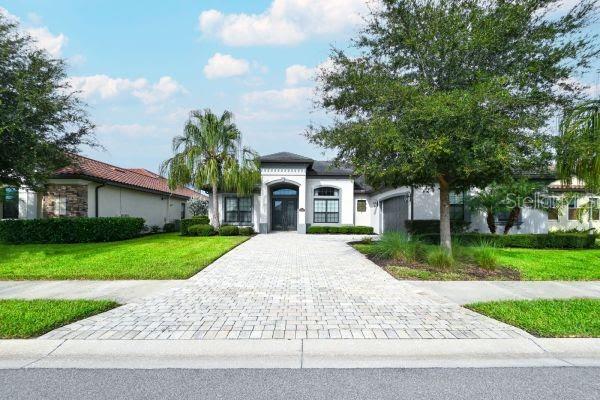 Property is open for the month of Feb 2025 prime season. One of Lakewood National's finest Lennar furnished Bougainvillea models. This executive luxury home will not disappoint anyone that resides. The soaring decorative ceilings and unique hanging light fixtures through out will WOW you as soon as you come through the double wide front doors. The travertine cobble stone flooring is through out the entire living areas with carpet in the bedrooms. The formal dinning area has a built in dry bar for entertaining and light bright double windows viewing out the front of the house. This home has amazing views from the outdoor lanai, master bedroom suite, guest en suite, Living room, and open kitchen. These views are of rolling greens, pond wildlife, queen palm trees, 3rd hole, 4th tee and 5th fairway of the 1# golf course in the USA.. The huge kitchen granite stone breakfast counter is a great area for everyone to gather. The kitchen has built in oven and microwave with a gas range and real wood light colored tall cabinets with walk in pantry. Lets not forget the outdoor living areas with 2 covered areas to relax under and use the outdoor kitchen for grilling. Nice sized heated self cleaning pool with hot spa to enjoy with lite lanai beams for that real relaxing feel. This all comes with a $600 membership transfer to engage in all of Lakewood National's wonderful amenities on property. The owner does have a charging golf cart in the garage for tenants to rent for their convenience.
