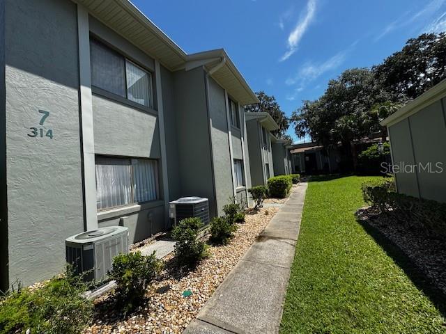 One or more photo(s) has been virtually staged. Check out this affordable, fresh, semi-updated Shangri-La condo in the heart of Palm Coast. It is a swift 5 minute walk to shopping, medical facilities, and parks. Seeing is believing! This spacious two-bedroom condo has had a major rehaul, including but not limited to the following: new carpet in the bedrooms, tile throughout, fresh paint inside, fresh paint in the semi-enclosed lanai, updated lighting, ceiling fans, toilets, bathroom vanity & mirrors. Spacious kitchen, eat-in kitchen area & spacious family room. Brand new washer & dryer. Say goodbye to popcorn ceilings. A POOL view in the front. A beautiful LAKE view in the back—a serene backyard with a natural lake, gazebo & nature in the heart of Palm Coast. The HOA includes exterior insurance, water & trash, pool maintenance, grounds upkeep, and exterior maintenance.