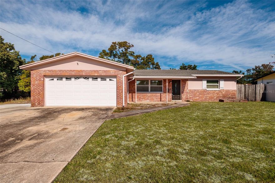 Fantastic opportunity to own this beautifully updated 3 bedroom, 2 bath home located just minutes to the beaches, THE SKYWAY BRIDGE, Downtown St Pete and the interstate, perfectly positioned as the last house at the end of the street on a spacious corner lot. This charming brick home features a wonderful split floor plan with a welcoming living room, formal dining area, and a comfortable family room, all enhanced by gorgeous luxury vinyl flooring throughout. The impressive primary suite offers a stunning remodeled bathroom and a generous walk-in closet, while the additional bedrooms provide excellent flexibility for guests, family, or a home office. Enjoy relaxing on the cute front porch or entertaining on the private back patio with plenty of yard space for pets, or gardening. With a convenient two-car garage, solid construction, and move-in-ready condition, this home is priced to sell and ready for its new owners!