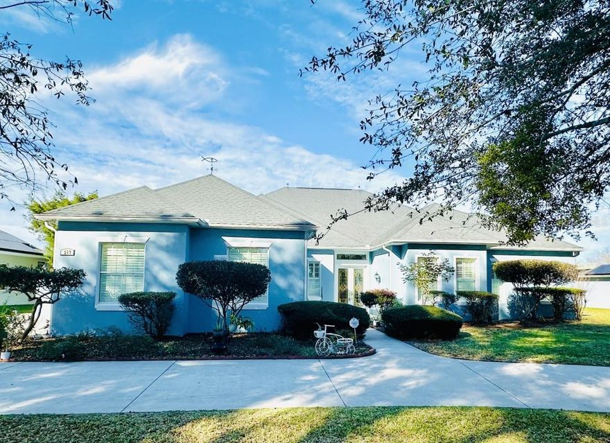 Beautiful 3 bedroom, 3.5 bath golf front home located in Lakes of Lady Lake, just minutes from The Villages. Situated on a .36 acre lot, this home offers an open design with 10 foot and 12 foot ceilings throughout. Plantation shutters, crown molding, custom casings, and architectural columns add timeless elegance and architectural detail.

Each bedroom features its own en-suite bath, providing privacy and convenience. The spacious primary suite includes a low maintenance onyx shower installed in 2020. Recent updates include a new HVAC system and fresh interior and exterior paint in 2020. The water heater was replaced in 2025. There is also a whole home water filtration system. Enjoy outdoor living and year around relaxation in the Hot Springs saltwater spa. Generous living spaces, abundant natural light, and a functional layout make this home ideal for everyday living and entertaining. Well maintained, thoughtfully updated, and move-in ready-schedule your showing today.