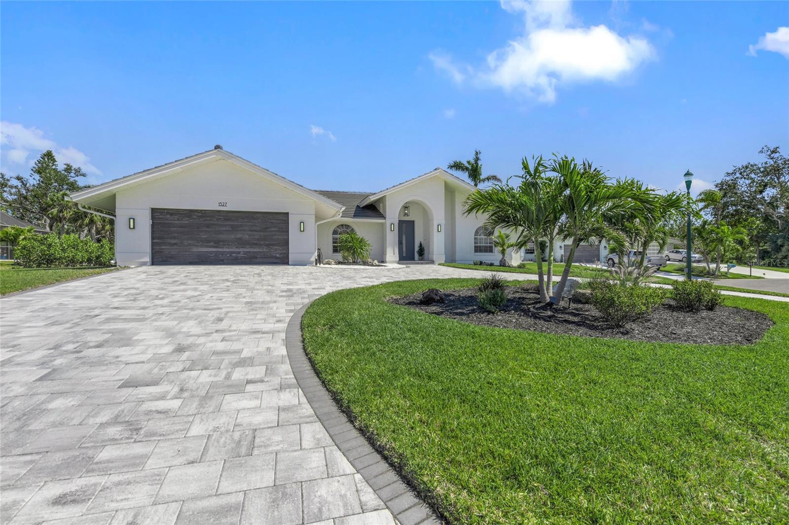 Beautifully and thoroughly recently updated beach style home in Southbay Yacht and Racquet club featuring 10 foot ceilings. 2024 tile roof, 2023 driveway, cabinets, lighting, appliances, tile and carpet are just the beginning. 2023 pool and spa led lighting, Pentair controller, saltwater conversion, and owned 250 gallon propane. Dry bar with ice maker, wine fridge, and beverage fridge. Large covered outdoor living space overlooking the large lanai with tv, private tanning area, and room to entertain. A split bedroom design, game room with space for billiards table, and separate dining area, and great room surround the private courtyard layout designed to entertain. Ample storage throughout including an air conditioned, secure 12x7 storeroom.
Southbay Yacht and Racquet Club offers a clubhouse, tennis, pickleball, basketball, shuffleboard, playground, and low fee, exclusive dockage for residents in the deep water marina. Frequent community activities provide opportunities for an active social atmosphere from cruises to sports.