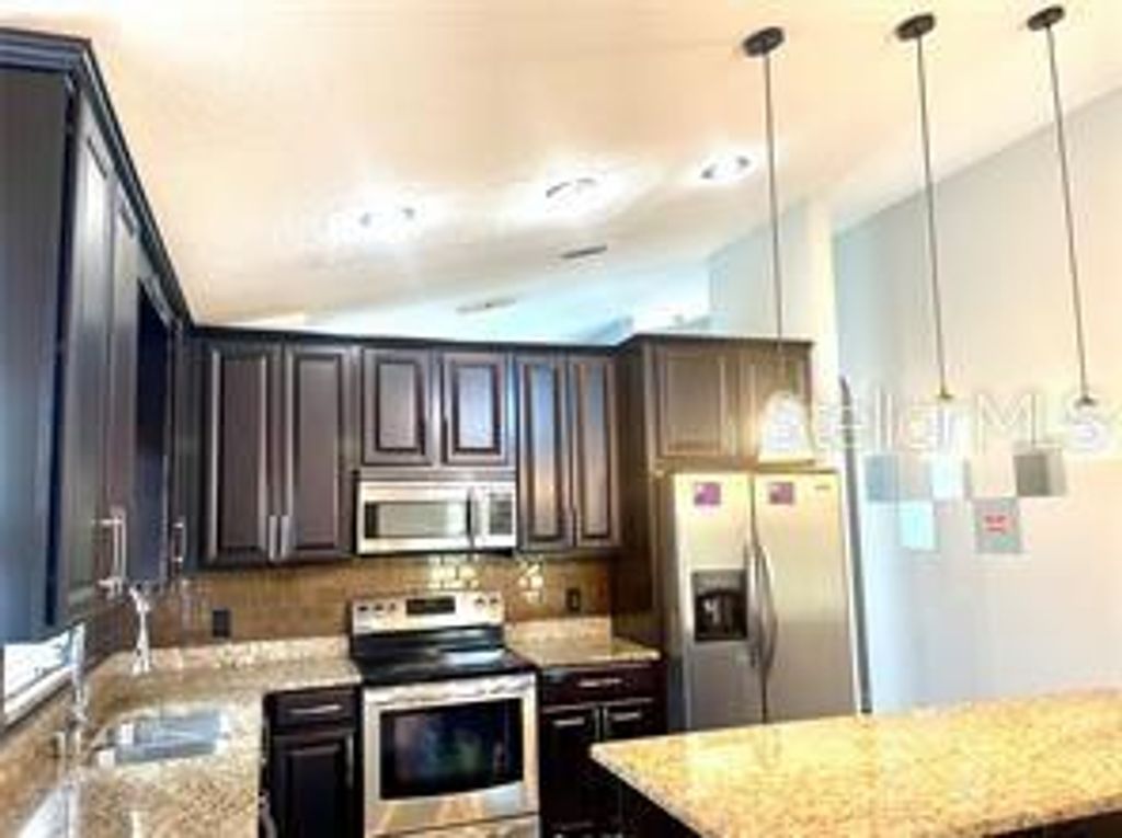 Photo of 13602 Glasser Avenue, Orlando, FL 32826 (MLS # O6389579)