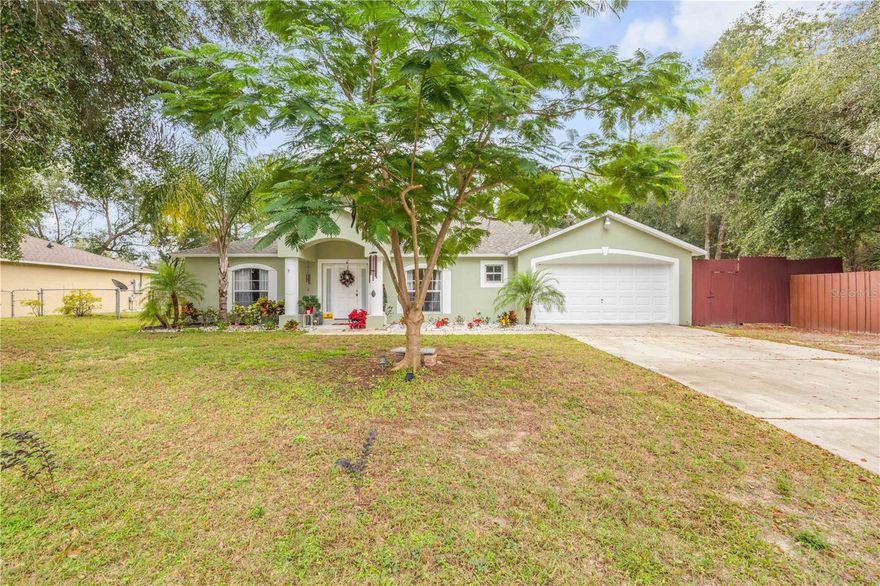 This 3-bedroom, 2-bathroom home in Deltona Lakes offers 2,020 square feet of spacious living. Featuring a new roof (2025) and new water heater (2024), the home combines practical updates with an open, vaulted ceiling layout. The kitchen boasts stainless steel appliances, a center island, and a bright eating nook that overlooks the living room, creating a welcoming space for family and entertaining. The primary bedroom includes an en suite bathroom with a separate tub and shower. Two additional bedrooms provide flexibility for guests, office space, or hobbies. Outside, the fenced backyard sits on just under a quarter-acre, offering room for outdoor activities or relaxation. Conveniently located near grocery stores, restaurants, and other amenities, this home provides easy access to everyday conveniences while maintaining a quiet neighborhood feel. With functional living spaces, modern updates, and a versatile layout, this Deltona Lakes property is ready for its next chapter. Mortgage savings may be available for buyers of this listing.