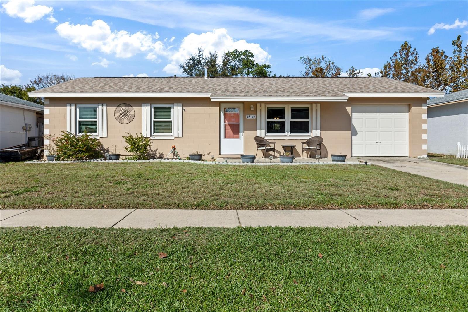 Adorable, well-maintained charmer in Ormond Beach! This three-bedroom, one-and-one-half-bath concrete block home is situated in a central neighborhood and offers so much for a first-time homebuyer, retiree, or someone looking to downsize. All the work has been done to this cutie, including a newer roof, newer windows, a newer garage door, beautiful vinyl and tile floors throughout (no carpeting!), a screened-in porch large enough to entertain and host a barbecue, a fully fenced backyard for the kids and pets, a large laundry/mudroom area for folding laundry and for storage, and a one-car garage. The gleaming kitchen features sparkling, all-white appliances and is open to the heart of the home, including your living room and eat-in dining area, and no HOA! This affordable house is a special value for a buyer looking to move right in and doesn't want to take on a project. There's nothing to do here but start living! All information taken from the tax record, and while deemed reliable, cannot be guaranteed.