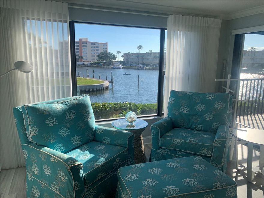 Gorgeous waterfront condo at The Moorings! You will love the view and the comforts of this well decorated condo in a coastal theme with a stunning view of Blind Pass Intercoastal and a partial view of the Gulf of Mexico just beyond. This community consists of just 17 condos and is on the quieter southern end of Siesta Key. Enjoy your private boat slip or just fish off the dock. Primary bedroom has customized storage and closet area and features a king-sized bed. Beautiful ensuite bathroom is remodeled and updated, as is the guest bath. This space also opens up to the screened in 12 x 10 balcony overlooking the water where there are usually kayakers and paddleboarders. The second bedroom has a queen and a twin bed. You will love the kitchen and eating your meals from bar area where you can view out your large living room window with electric shades. For your convenience, The Siesta Key Trolley, which is a constant running free "hop on" and "hop off" way to get to other areas on the Key, that stops right in from on Midnight Pass Rd. Repeat guest cannot return and this beautiful vacation property just opened up.