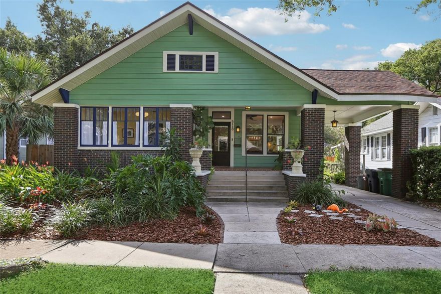 This stunningly restored 1910 bungalow blends historic charm with modern upgrades. Located in the heart of historic Seminole Heights on a large 61x132 lot, this home has beautifully refinished hardwood floors, crown molding, and high ceilings throughout. The living and dining rooms feature recessed lighting, custom light fixtures, and bottom-up cordless shades for privacy and style. The kitchen is a chef’s dream, boasting stone countertops, stainless steel Samsung appliances, a walk-in pantry with built-in shelving, and direct access to the utility room and outdoor deck. The newly remodeled primary suite includes a built-in closet and a luxurious full bathroom with stone counters and a walk-in shower. Bedroom 2 opens to a sunroom through French doors and showcases tile flooring and a custom light fixture, while Bedroom 3 offers a built-in closet and a cozy den/office space wrapped in windows and beadboard paneling, perfect for work or relaxation. The 2nd bath was renovated with classic tile honoring the era of the home.  The utility room includes washer/dryer, built-in storage, and backyard access. Outside, enjoy a covered front porch, a huge back yard, and a long driveway with porte cochère. The backyard is ideal for entertaining, with a wood deck, paver patio, gated side yard, alley access, and a storage shed. 
Recent updates include a new roof (2023), AC system (2020), foundation restoration (2022), and a PEX plumbing system (2016). The home also features a tankless electric water heater and water softener. This prime property offers walkable access to Florida Avenue’s most sought-after restaurants and is just minutes from Raymond James Stadium, Armature Works, Downtown Tampa, Tampa International Airport, and I-75.