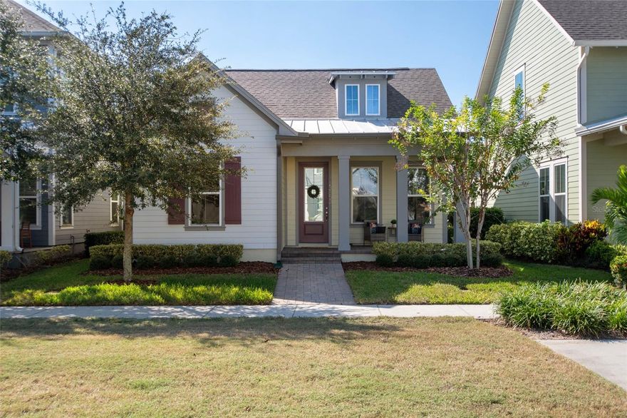 Welcome Home! This charming, beautiful, and meticulously maintained single-story home offers amazing curb appeal and is perfectly situated on a Mews Lot in the highly desirable community of Laureate Park in Lake Nona, Orlando, FL. Enjoy quiet mornings with a cup of coffee or unwind with a good book on your quaint front porch overlooking the lush, manicured greenspace. Step inside to a welcoming foyer featuring luxury vinyl plank flooring that flows seamlessly throughout the main living areas. Experience the comfort of an open-concept floor plan that includes a family room, dining area, and kitchen combination. Your spacious family and dining rooms are bathed in natural light from surrounding windows—creating the perfect atmosphere to relax and reconnect after a long day. Adjacent to the family room, you’ll find a full bathroom and two inviting bedrooms. Down the hall lies the heart of the home—your bright, spacious, and stunning kitchen. Cook with ease in your gourmet kitchen, offering ample counter space, a single basin sink, quartz countertops, stainless steel appliances, shaker-style cabinetry, and premium upgrades such as cabinet drawer systems, pull-out trash bins, under-cabinet lighting, and a walk-in pantry. Tucked away off the kitchen is your oversized master bedroom featuring an ensuite bathroom with a large walk-in shower showcasing floor-to-ceiling tile and a rain shower head. The elegant double-sink vanity with quartz countertops provides abundant storage, and the expansive walk-in closet completes this serene retreat. Conveniently located off the kitchen, your walk-in laundry room has been upgraded with upper cabinetry for extra organization. At the back of the home, you’ll appreciate the built-in insert area—perfect for creating a custom drop zone to simplify daily comings and goings. Step outside to your rear covered and screened-in porch, ideal for enjoying Florida’s beautiful weather all year long. Additional upgrades include speaker pre-wiring in the great room and lanai, pre-plumbing for an outdoor kitchen, HVAC UV System, and a whole-home filtration and alkaline system, along with a Water Softener. The HOA includes high-speed internet (up to 1 GIG) and access to the Laureate Park Fitness Center, resort-style aquatic center, beach volleyball court, and half basketball court. Laureate Park also features community gardens, dog parks, playgrounds, and miles of scenic trails for walking, running, and biking. Enjoy a vibrant community lifestyle with events like Live & Local, Movies in the Park, Yoga, and more. Located in the heart of Lake Nona’s Medical City, with convenient access to the BEEP autonomous shuttle service, this home is near top-rated schools, Orlando International Airport, major highways, shopping, dining, the USTA National Campus, and KPMG.