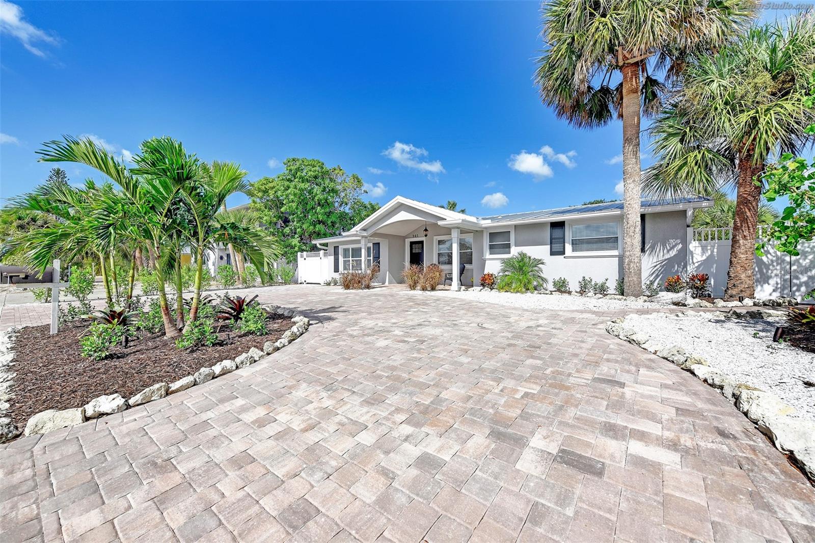 Listing reflects peak season rate. Available peak season months: January 2026, February 2026, March 2026, April 2026. Welcome to Leona's Retreat, a beautifully renovated, ground-level bungalow perfectly poised on the intercoastal canal waterway. This charming home offers the ultimate blend of peaceful island living and convenient access to all that Siesta Key has to offer. Step inside to a bright, coastal-styled haven designed for relaxation and comfort. The spacious primary bedroom features a plush king-size bed and a bathroom across the way, providing a private sanctuary. Two additional bedrooms offer flexible sleeping arrangements: one with a comfortable king-size bed, and the other ideal for families with a double bed and a single bed. You'll find a full kitchen stocked with all the essentials, plus a convenient washer/dryer to make your stay effortless. Outside, your expansive, private backyard is a true highlight. Take a refreshing dip in the private heated pool, unwind in the bubbling hot tub, or simply lounge in the ample space for sunbathing and outdoor dining. With direct access to the intercoastal canal, you can enjoy quiet moments fishing or watching the tranquil tides. Leona's Retreat boasts a truly prime location on a quiet, family-oriented street. You're just a delightful five-minute stroll to the vibrant Siesta Key Village, brimming with charming shops, delectable restaurants, and lively entertainment. And for those iconic beach days, the world-famous Siesta Key Beach is only a ten-minute walk away! We've ensured you're perfectly equipped for a memorable day by the sea. The home includes all the beach day essentials: beach chairs, beach towels, coolers, frozen ice packs, and a convenient cart to easily tote everything down to the sand. Ready to experience the best of Siesta Key? Book your unforgettable stay at Leona's Retreat today!