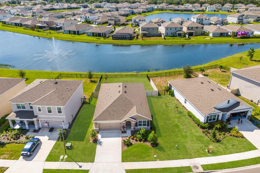 Better Than New & Priced to Sell! This beautifully maintained 2023 home sits on an OVERSIZED, pie-shaped lot with serene pond views and full fencing—offering privacy, space, and room to relax. Upgraded tile flooring throughout the main living areas and a premium lot set this home apart from new construction. Located in a maintenance-free community, the low HOA covers lawn care, community pool access, and playgrounds—perfect for easy Florida living. Just outside the neighborhood, enjoy access to the upcoming Manatee County Sports Complex, brand-new County Library, Premier Sports Campus for soccer/lacrosse, a new Publix under construction, and a new K-8 school nearby—everything you need just minutes away! Enjoy your mornings on the screened lanai with southern exposure, sipping coffee while watching birds and wildlife over the tranquil water. With a re-sodded yard, thoughtful upgrades, and a prime location in the heart of Lakewood Ranch, this move-in-ready home is a rare opportunity at an exceptional value.
