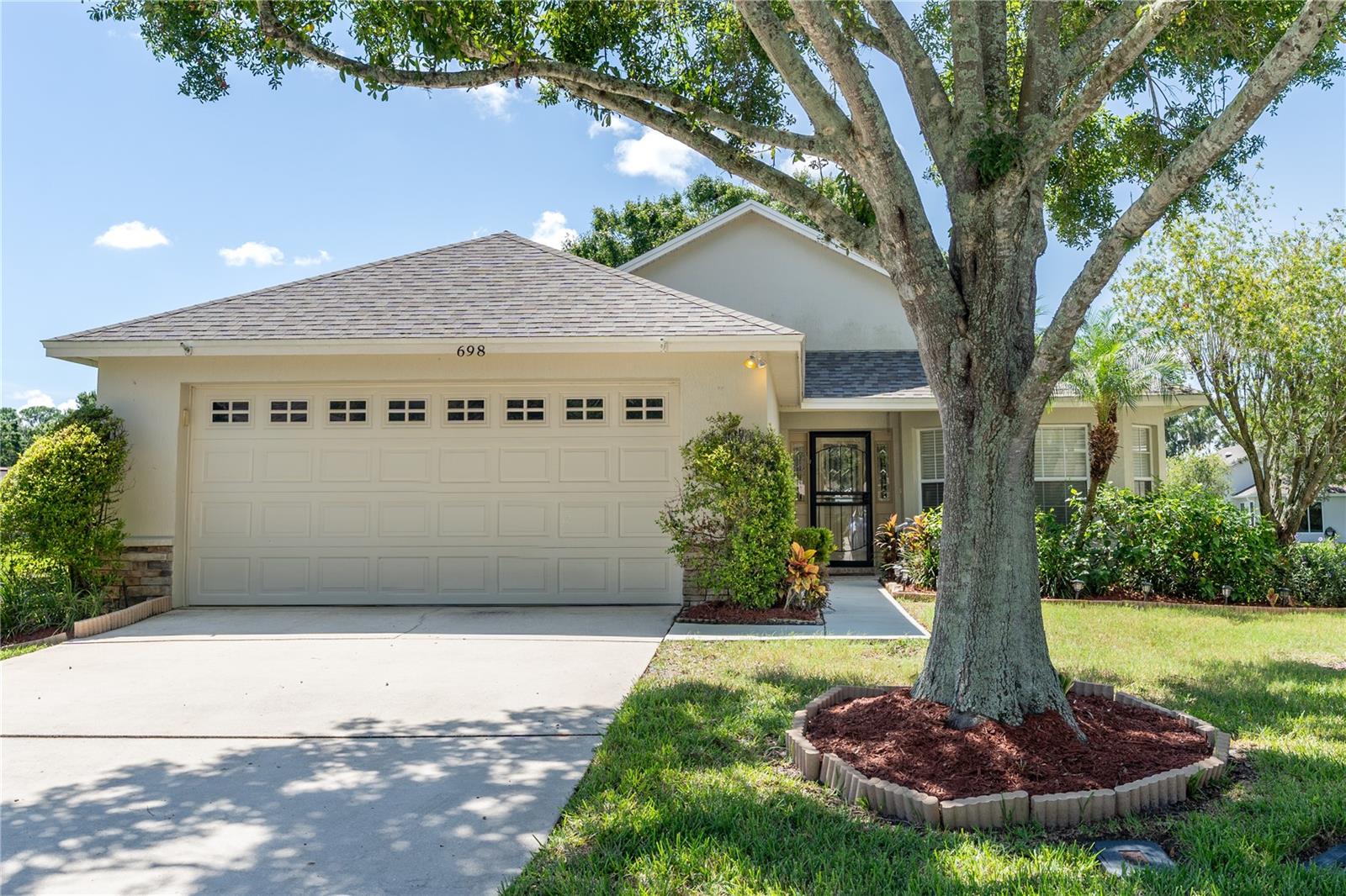 Welcome to 698 Lake Clark Place, a beautifully maintained 3 bedroom, 2 bathroom home located in the gated community of Christina Hammock. This residence offers a desirable split floor plan with impressive 12-foot ceilings in the living room and an abundance of natural light throughout. Recent updates provide peace of mind, including a new roof (2021), new air conditioning unit (2021), new stove and microwave (2022), new water heater (2022), new garbage disposal (2022), exterior paint (2023), and brand-new gutters (2025). The spacious screened lanai overlooks a tranquil pond with wildlife, ensuring no rear neighbors and providing a private retreat right in your backyard. Nestled at the end of a quiet cul-de-sac, this property also features beautiful landscaping and excellent curb appeal. Enjoy the community tennis court, gym, pool, and clubhouse all within just a few minutes' walk from the home. Move-in ready and situated in one of Lakeland’s most sought-after communities, this home combines comfort, convenience, and Florida living at its best.