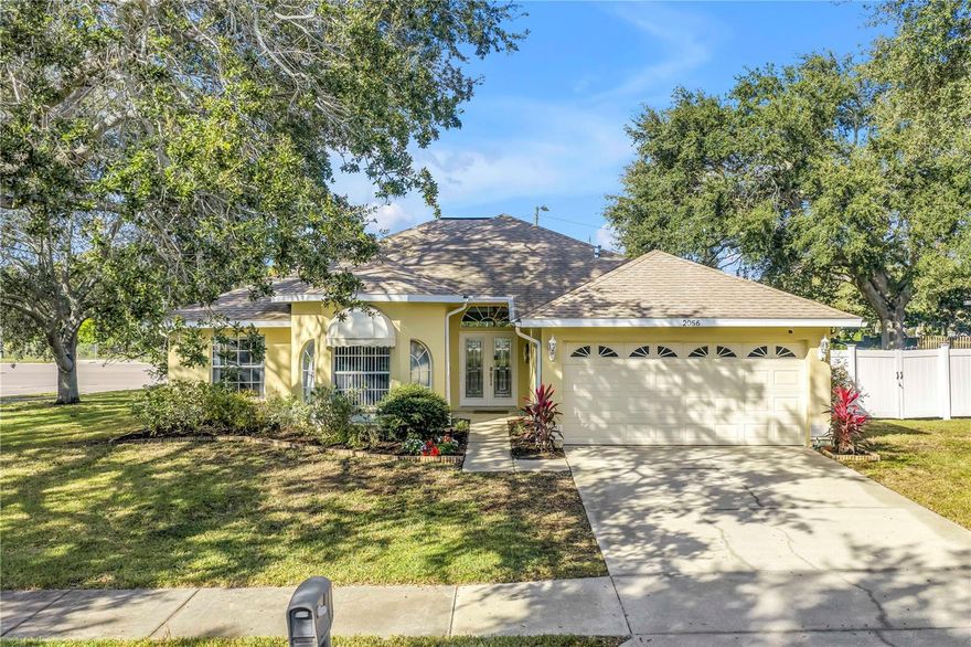 Welcome to this beautifully maintained 3-bedroom, 2-bathroom, 2-car garage pool home in desirable Dunedin.  Built in 2001 with solid block construction, this home sits gracefully beneath the shade of mature oak trees on a spacious 120’ x 110’ corner lot.
As you arrive, you’ll appreciate the home’s curb appeal, enhanced by thoughtful landscaping and ample yard space.  Step through the French front doors into the main living area, where elevated ceilings, engineered hardwood floors, and an abundance of natural light flowing through the open-concept design create a warm, inviting atmosphere.
The split floor plan offers privacy and functionality.  The primary suite sets a spacious tone with its vaulted ceiling, generous walk-in closet, private lanai access, and updated ensuite bath featuring a walk-in shower.  Just across the home, two comfortable guest bedrooms and a guest bath provide a relaxing retreat for family or visitors.
Continue through to the heart of the home, the kitchen, recently refreshed with painted cabinetry, granite countertops, stainless steel appliances, and a convenient breakfast bar, perfect for morning coffee or casual dining.  Adjacent to the kitchen, the flexible dining area and second living space offer versatility for entertaining, working from home, or relaxing with family.
Standout feature is the accessibility to the enclosed salt water pool area from the living and dining areas.  The pool was resurfaced in 2021, and the expansive side yard offers a blank canvas to create your own outdoor oasis or garden retreat.  Additional updates include a new roof (2019), HVAC (2021), Vivint smart security system with smoke detectors, gutter covers and drainage upgrades.
While conveniently located offering quick access to shops, dining, and entertainment.  Just minutes from Downtown Dunedin, Honeymoon Island’s pristine beaches, and local piers and marinas, this home truly captures the best of the Dunedin lifestyle.