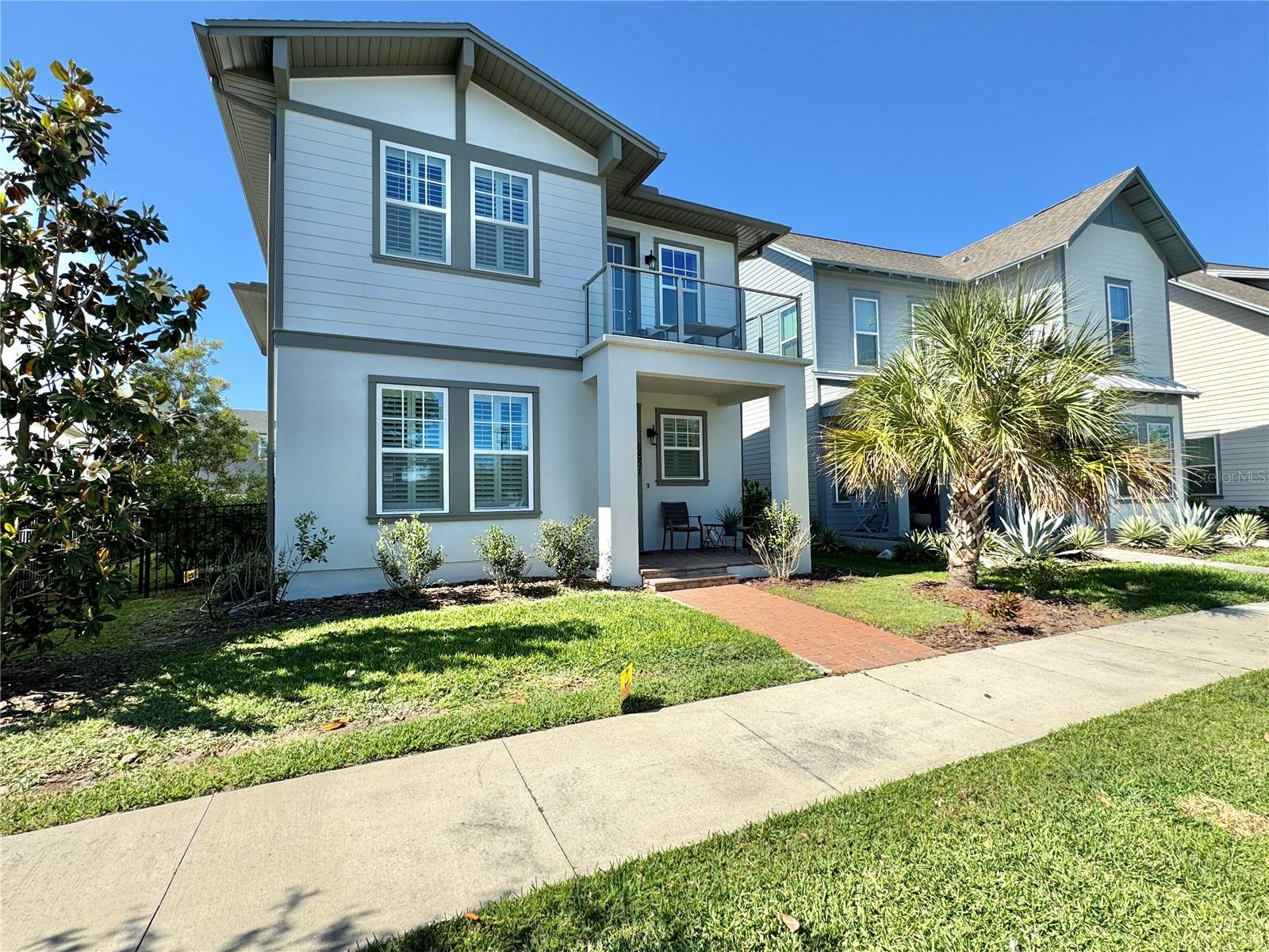 This amazing highly upgraded home by Ashton woods will make you feel right at home. As you walk towards the front of this gorgeous home you will notice how the curb appeal will draw you in...quite mesmerizing! It sits directly facing one of the most beautiful parks in all of Laureate Park at Lake Nona....not only does the home face the park but it has a glass balcony on the second floor that faces the park and is a great place to escape for your morning coffee or perhaps an evening libation! This home boasts plenty of space and has a flex room that can be used as an office/den, formal dining or even separate formal living as the home has a grand family/living adjacent the kitchen so the choice is yours....Kitchen has all of the goodies you would love to have including White cabinets and Quartz countertops 42 inch uppers and an absolutely gargantuan island to relax and entertain friends and family. Master is upstairs with two other bedrooms including the glass balcony! This home also has a garage apartment that could also be rented separately for those who may want Mom/Dad or perhaps a family member or friend to live close by...some even use these as a work space to separate home from work in another environment. This home is a short work to Nemours Children's Hospital and a quick trip to the VA, Boxi Park, USTA, Orlando International Airport, and soooooo much more. Don't miss out on this one folks! Great Home, Great Neighbors and wonderful location! Oh, and the entire yard is fenced in to help keep the kids corralled as well as your furry friend!