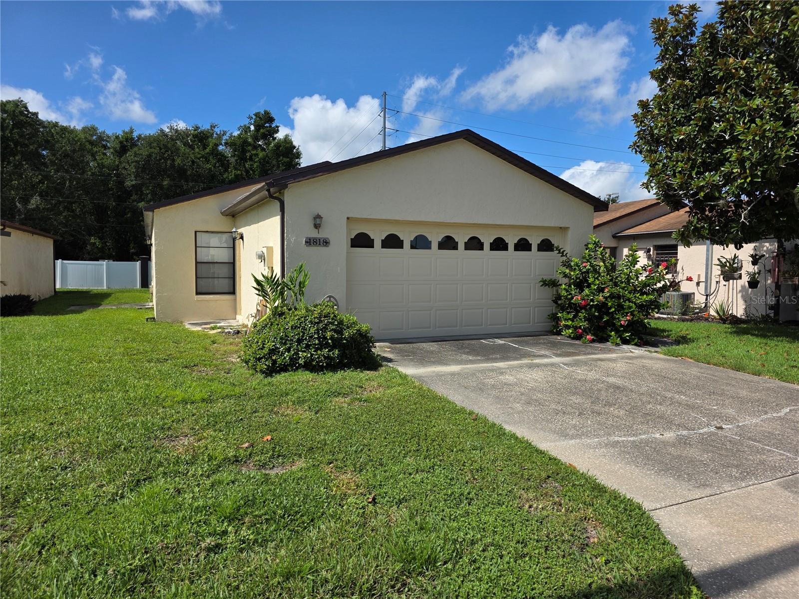 Located in the desirable 55+ community of Spanish Haven in Winter Haven, this well-maintained 2-bedroom, 2-bathroom block home offers solid construction and a great layout. While the home retains some vintage charm, it remains in good condition with spacious living areas and plenty of natural light. The open-concept layout seamlessly connects the living and dining spaces, offering a comfortable area for relaxation or entertaining. The kitchen, though slightly dated, is functional with ample storage and counter space. The master suite includes an en-suite bathroom for added convenience, while the second bedroom provides versatile space for guests, a home office, or personal hobbies. Outside, the private backyard offers a peaceful setting for enjoying Florida’s beautiful weather. Spanish Haven is an active, welcoming community, ideal for those seeking a tranquil yet vibrant lifestyle. The home’s block construction provides long-term durability, and its well-maintained condition offers the perfect opportunity to update it to your personal style. Whether you’re looking to make some changes or move in as-is, this home provides a wonderful opportunity to settle in one of Winter Haven’s most sought-after 55+ communities.
